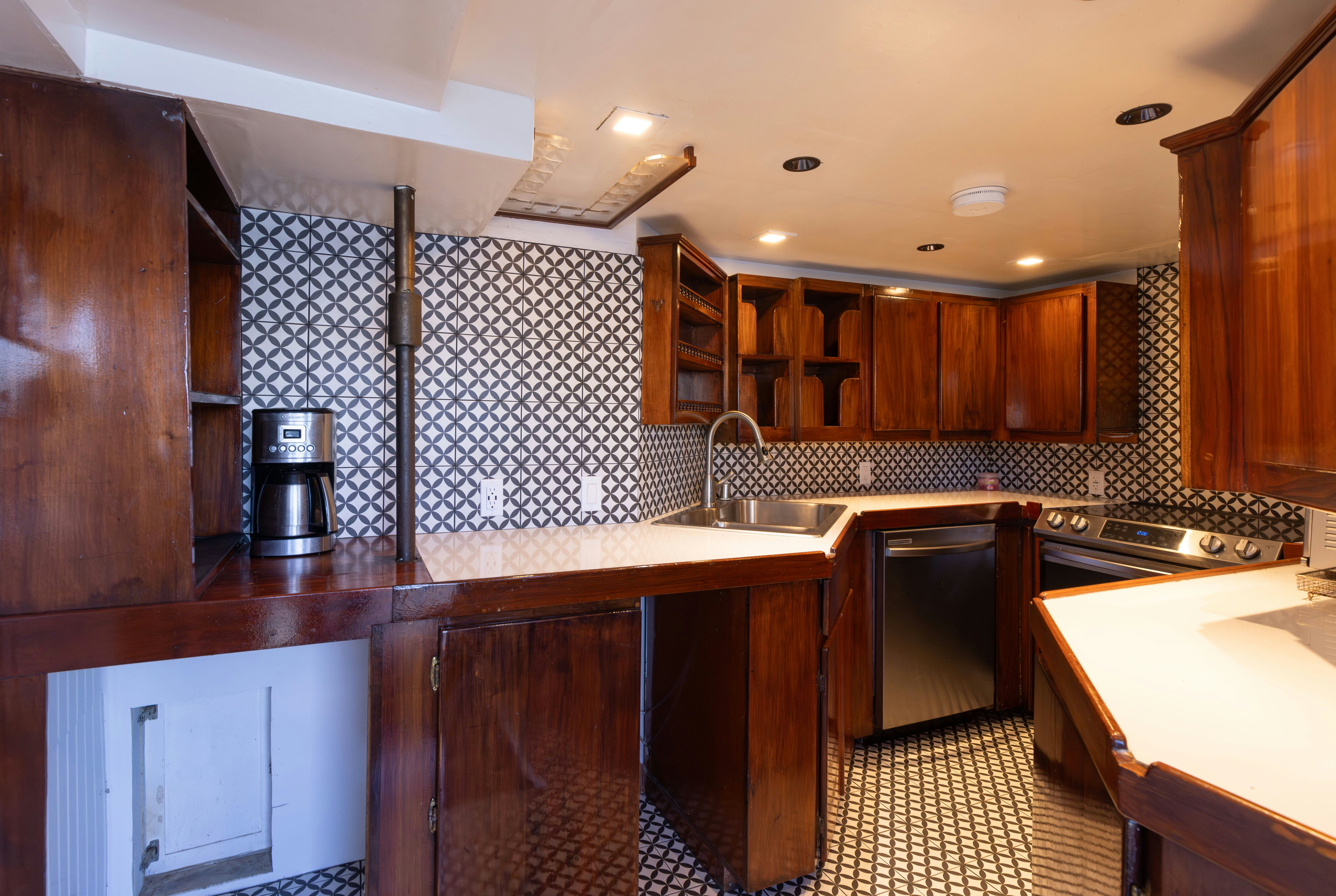 a kitchen with wooden cabinets aboard NORTHWIND Yacht for Sale