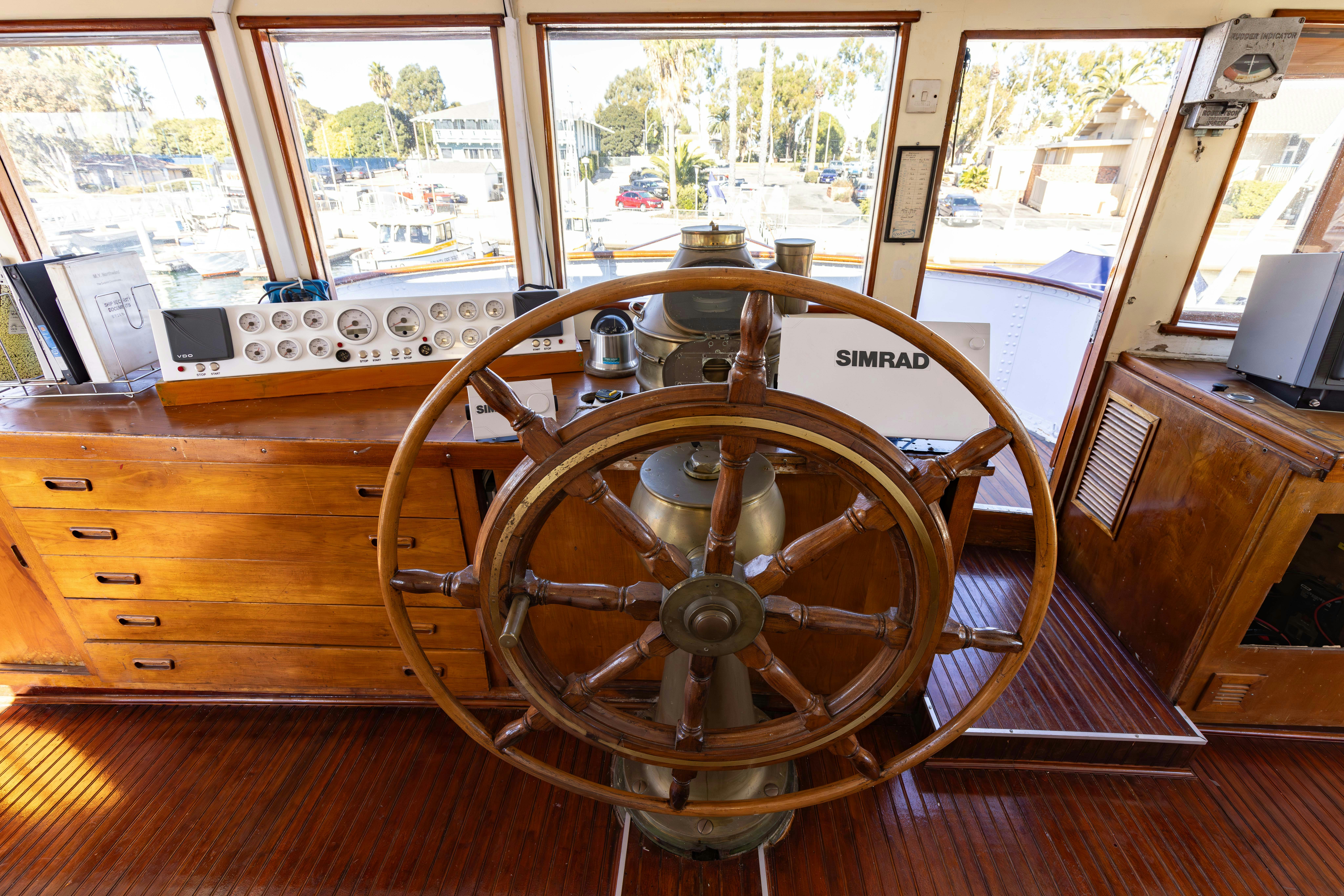 a wooden steering wheel aboard NORTHWIND Yacht for Sale