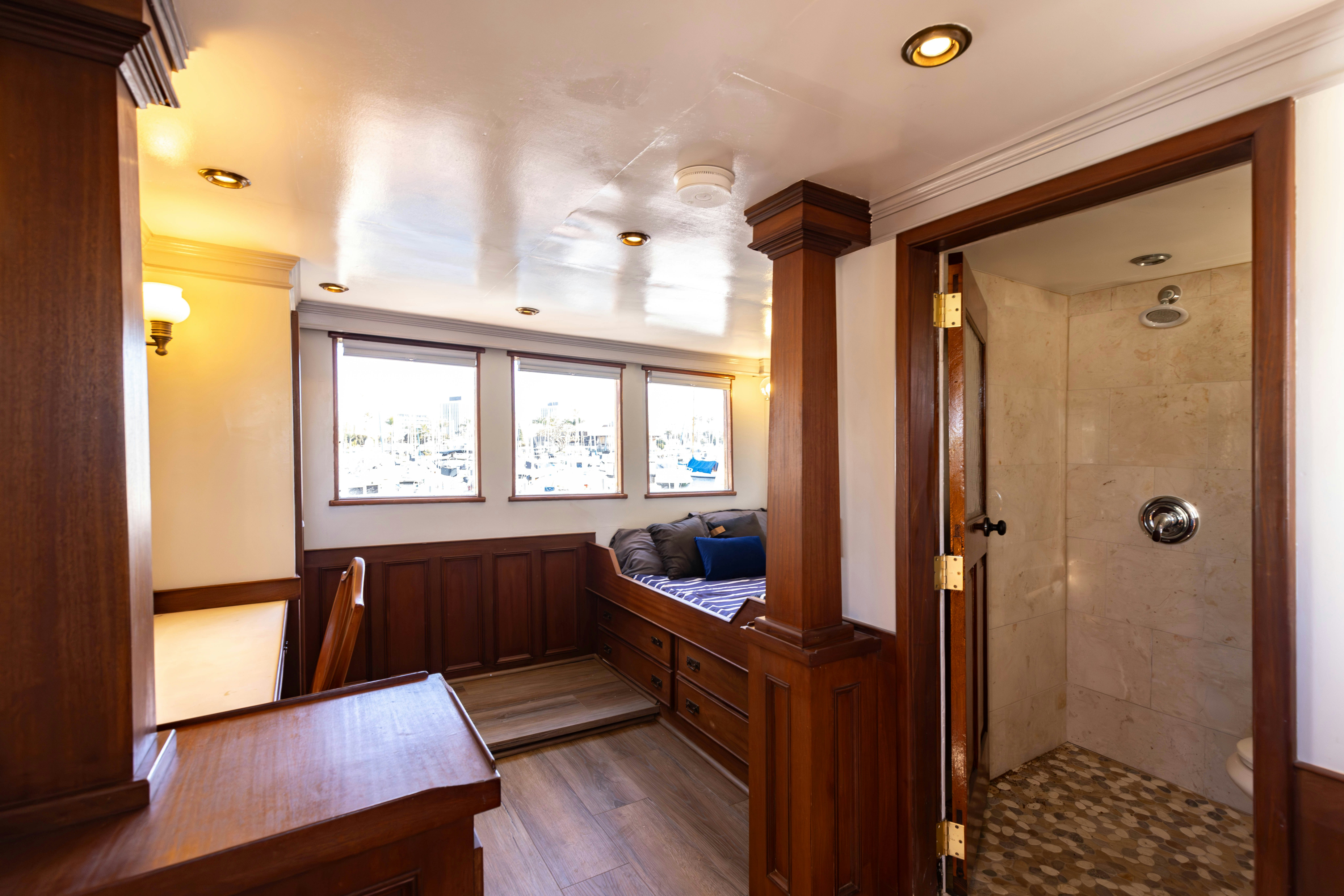 a room with a bed and a couch aboard NORTHWIND Yacht for Sale