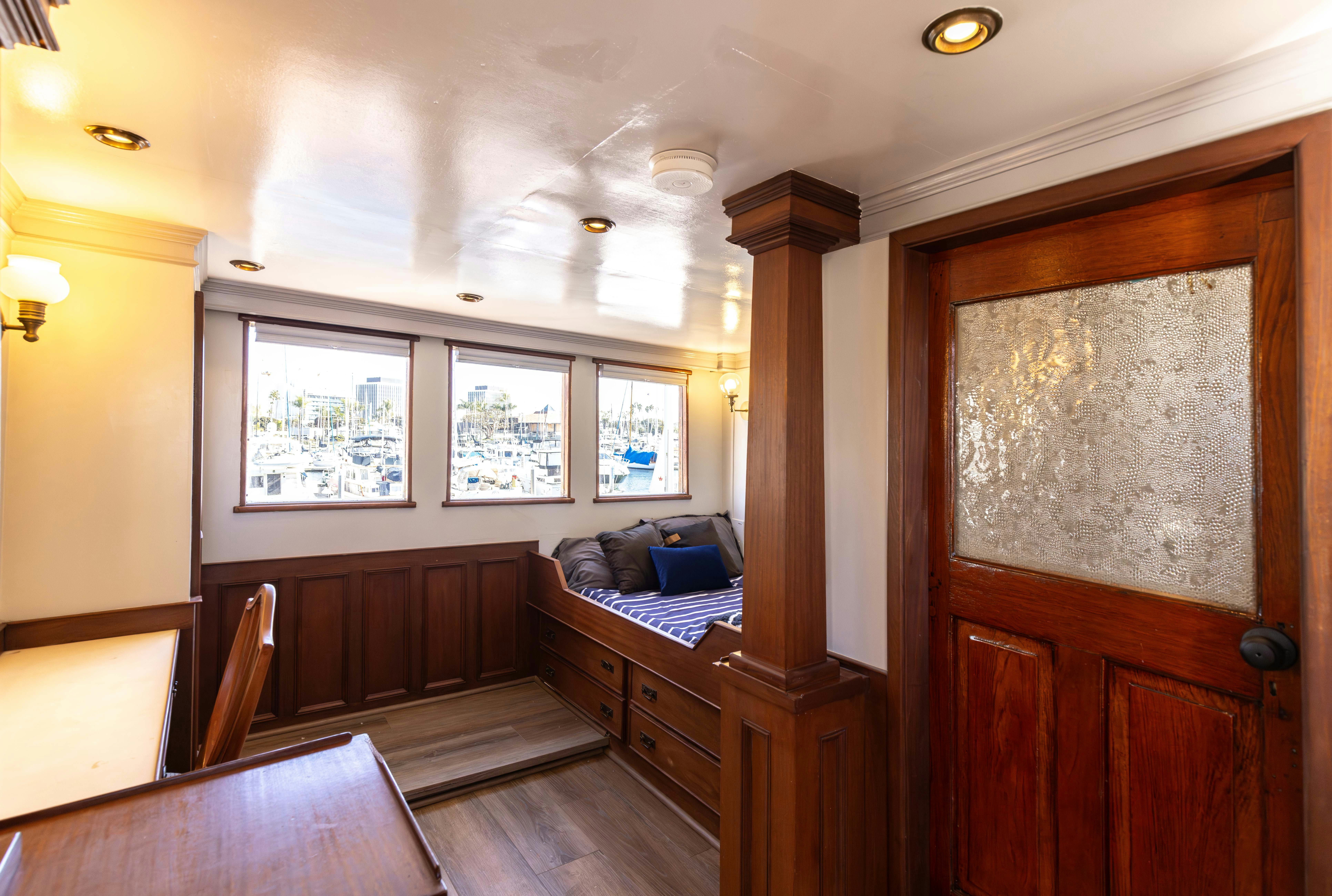 a room with a couch and a table aboard NORTHWIND Yacht for Sale