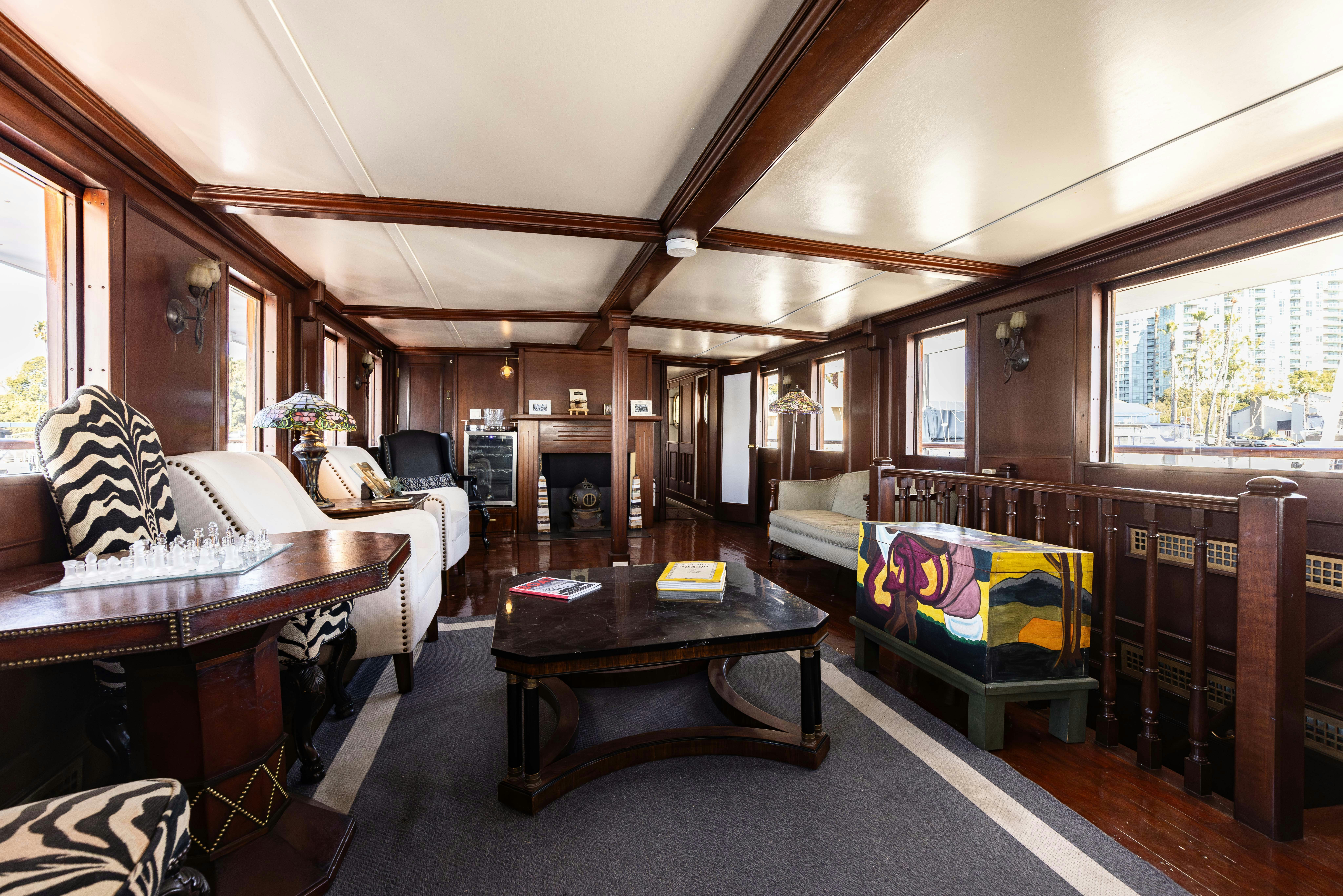 a bedroom with a bed and a table aboard NORTHWIND Yacht for Sale