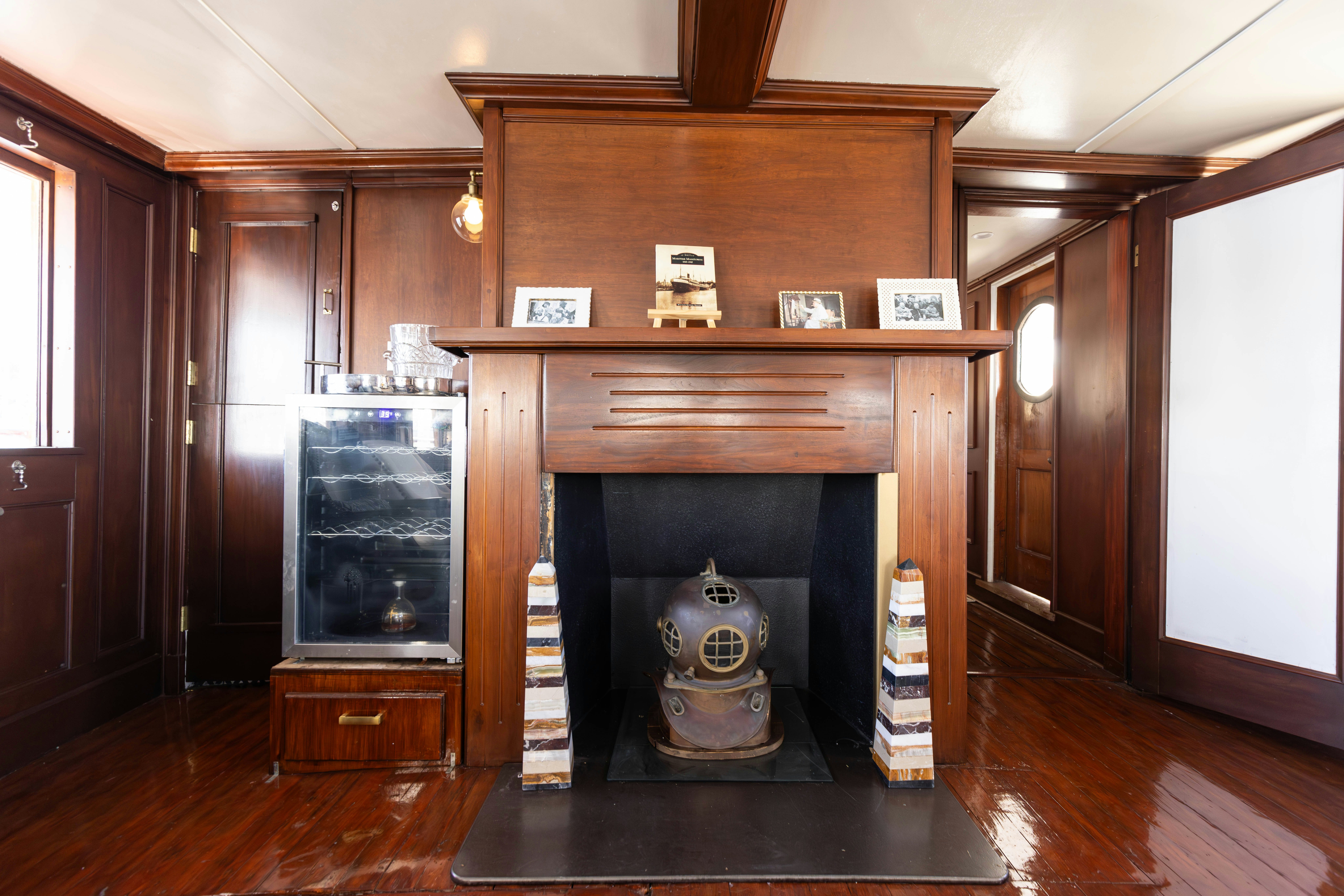 a fireplace in a room aboard NORTHWIND Yacht for Sale