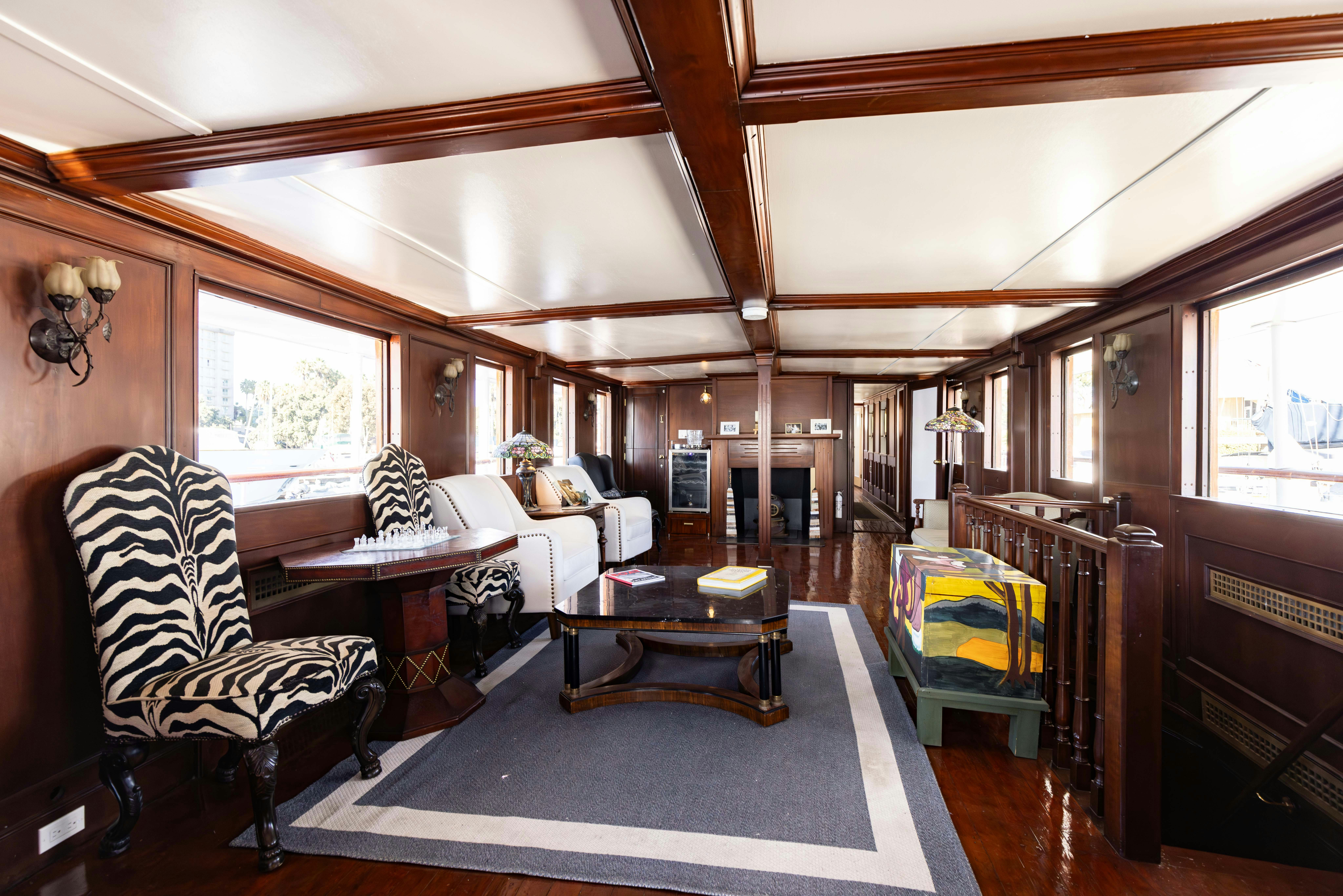 a room with a bed and a table aboard NORTHWIND Yacht for Sale