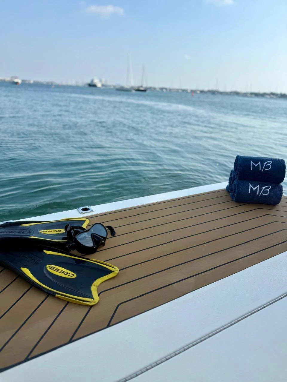 a yellow kayak on a railing overlooking a body of water aboard SCOUT 400LXF Yacht for Sale
