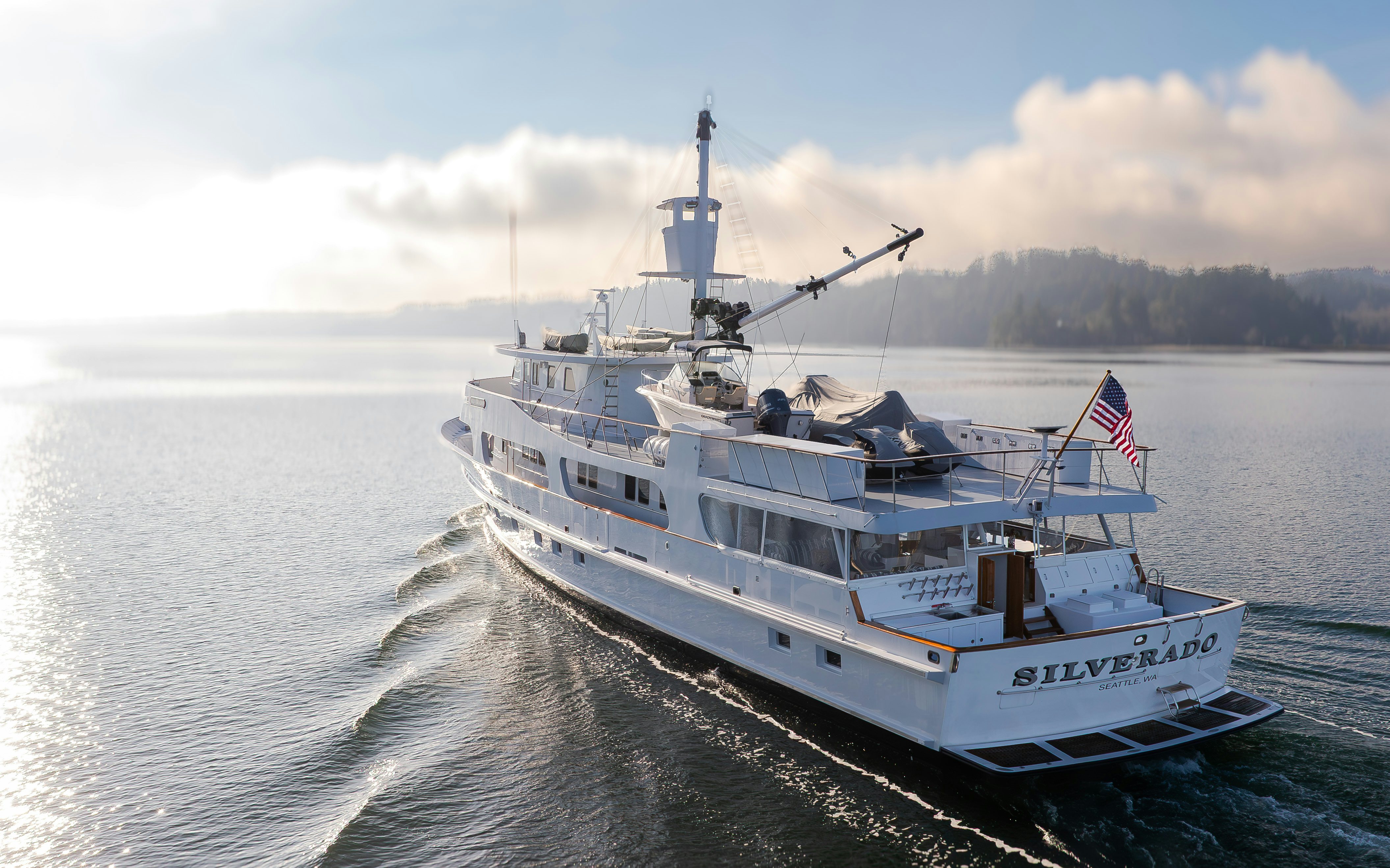 a large white boat on the water aboard SILVERADO Yacht for Sale