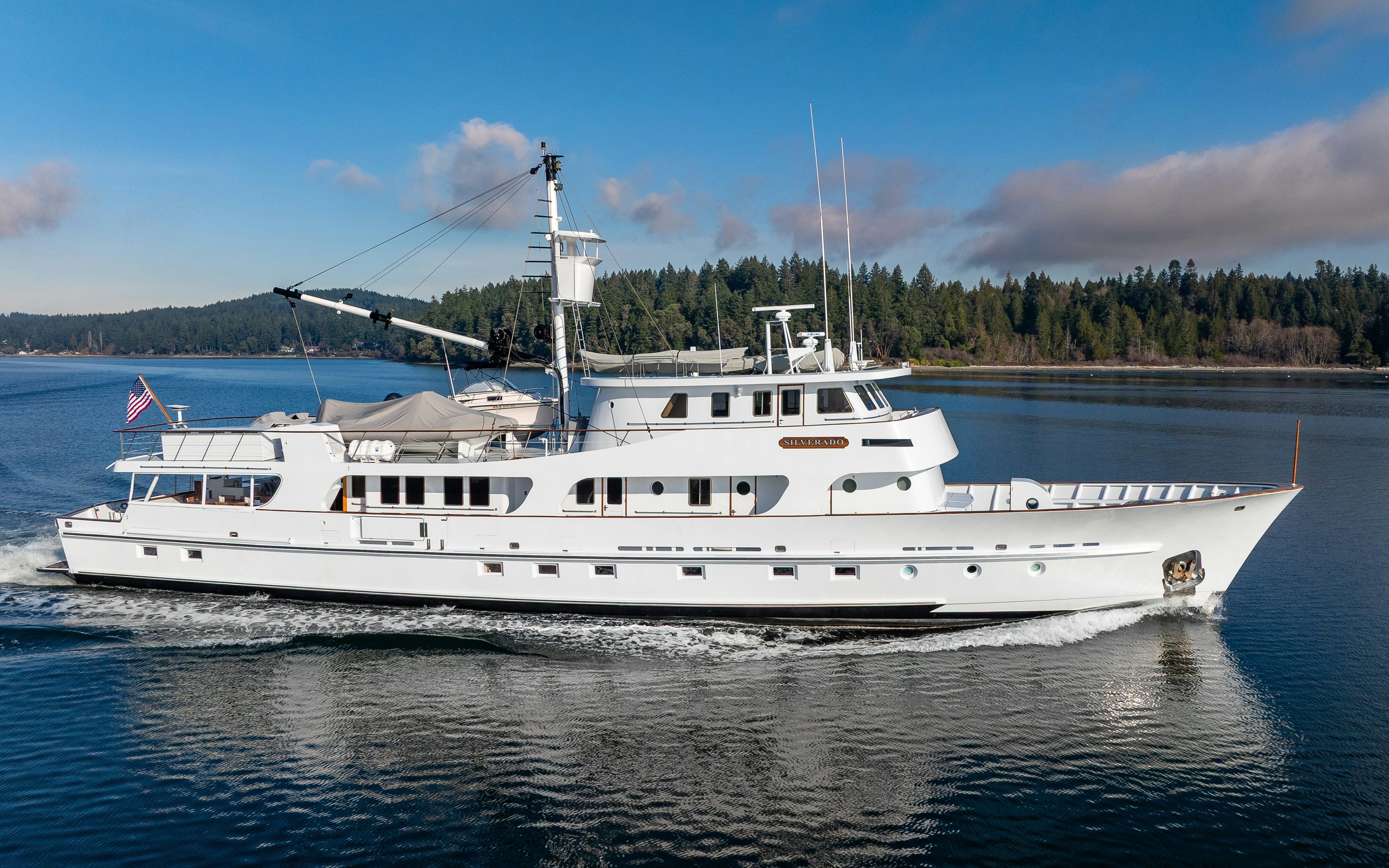 a large white yacht aboard SILVERADO Yacht for Sale