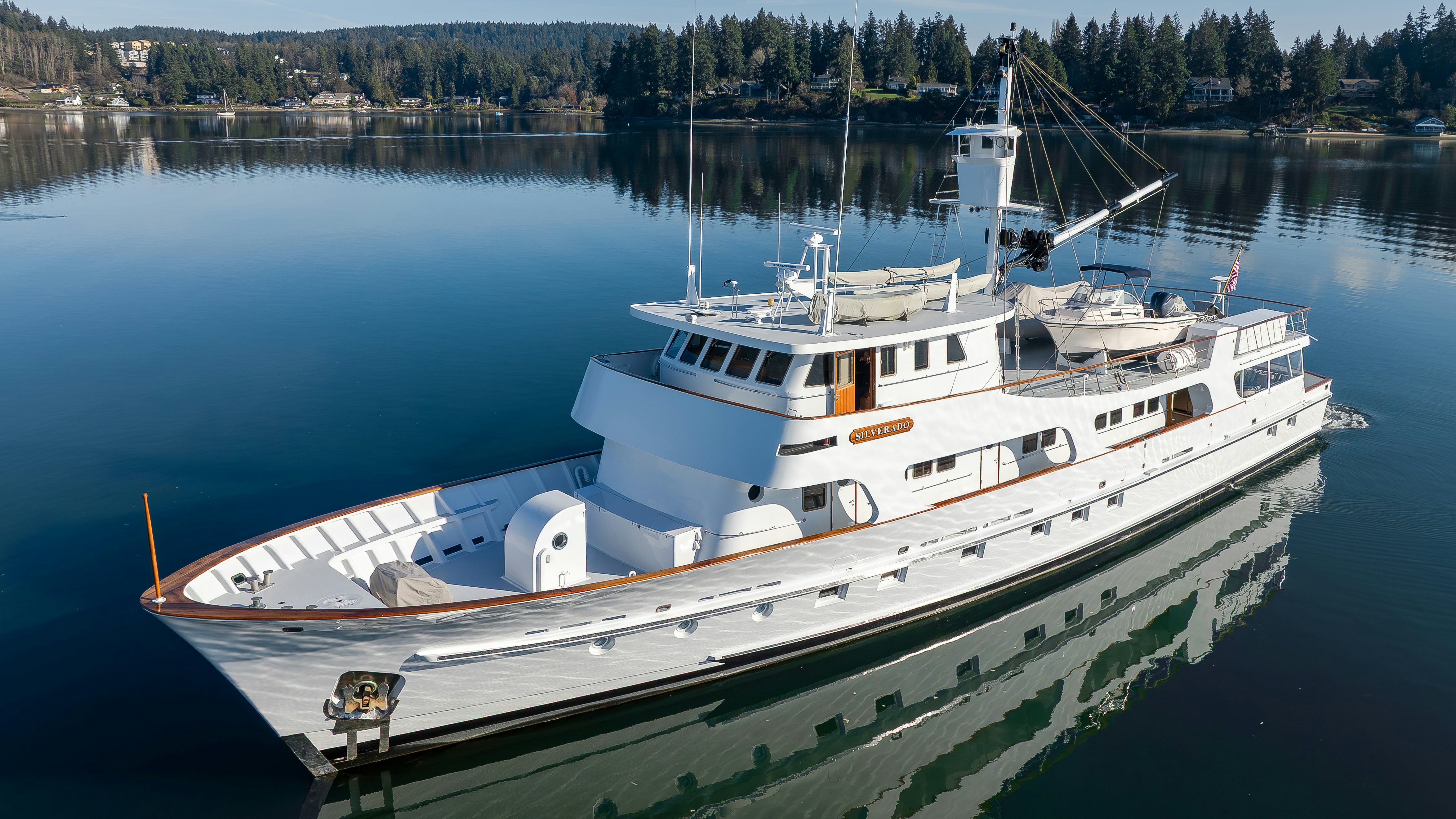 a large boat on the water aboard SILVERADO Yacht for Sale