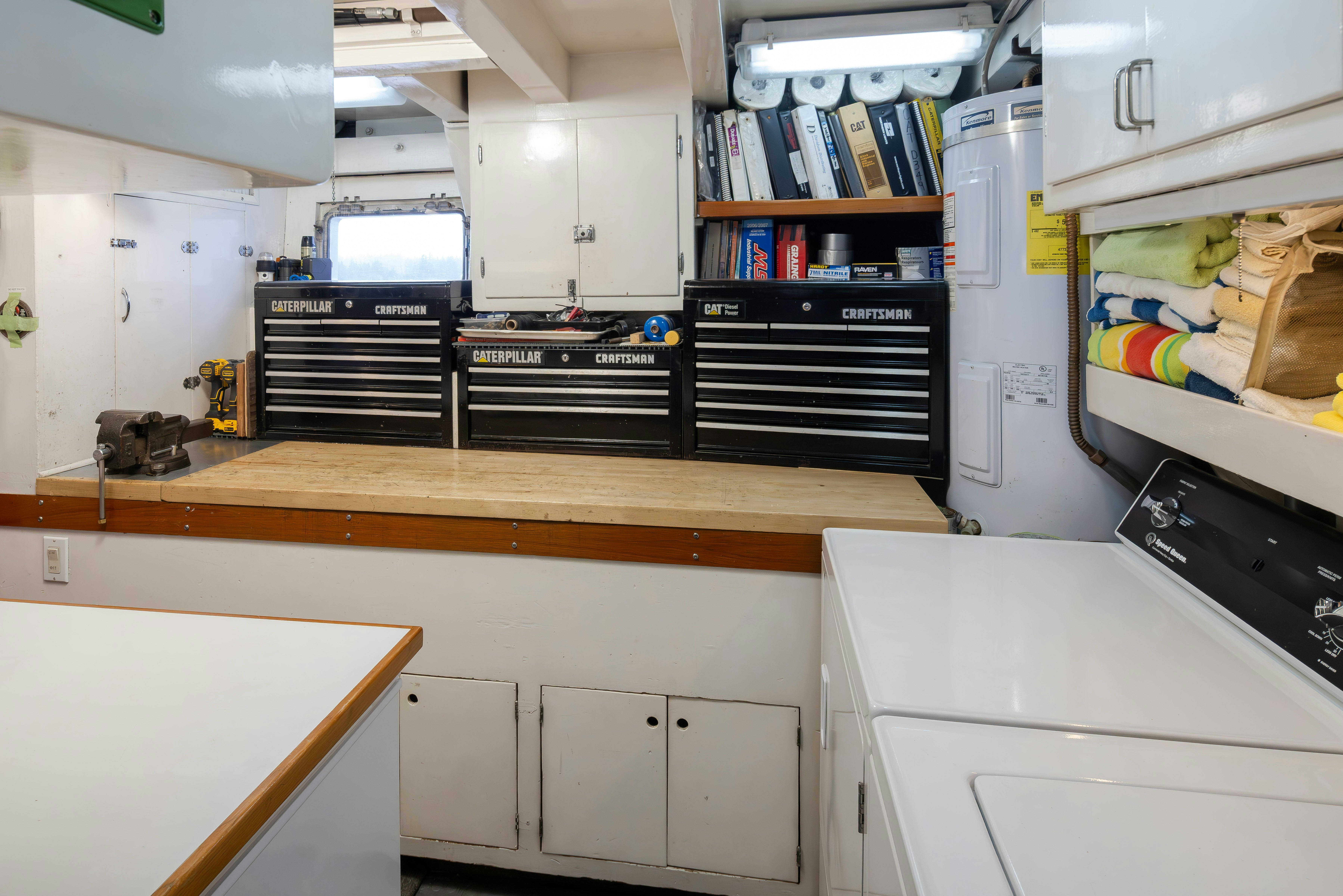 a room with a desk and shelves aboard SILVERADO Yacht for Sale