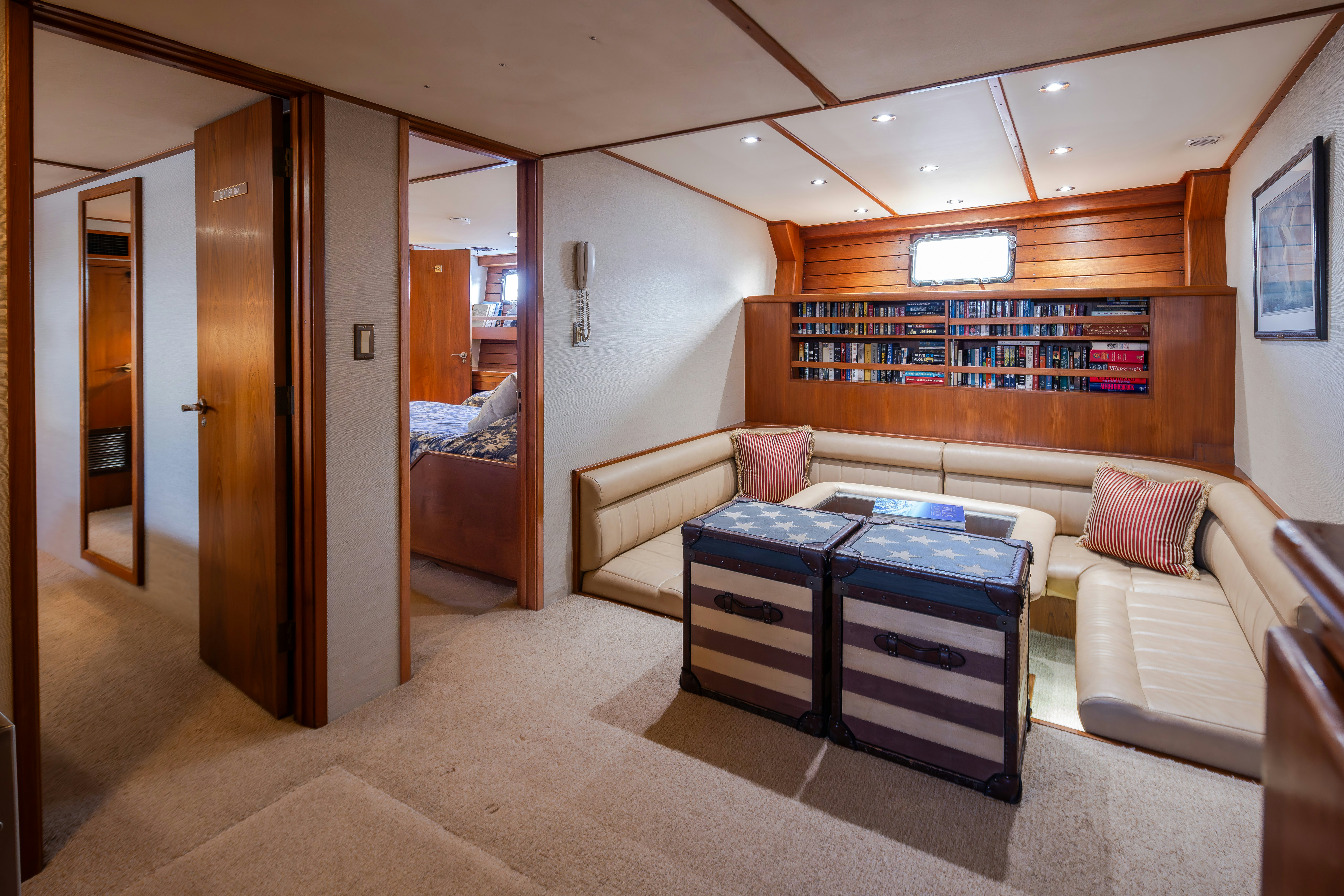 a room with a bed and a couch aboard SILVERADO Yacht for Sale