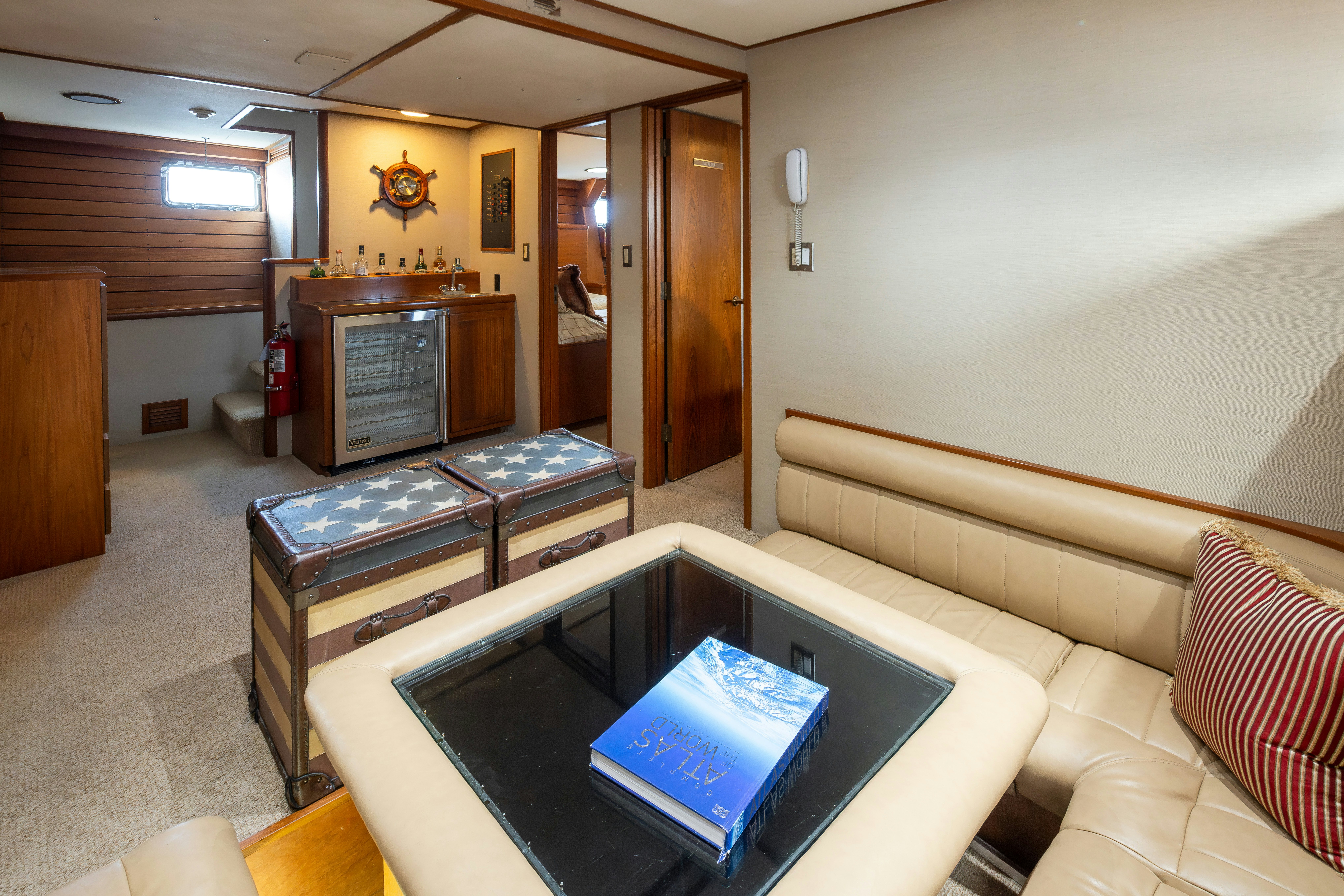 a living room with a couch and a television aboard SILVERADO Yacht for Sale