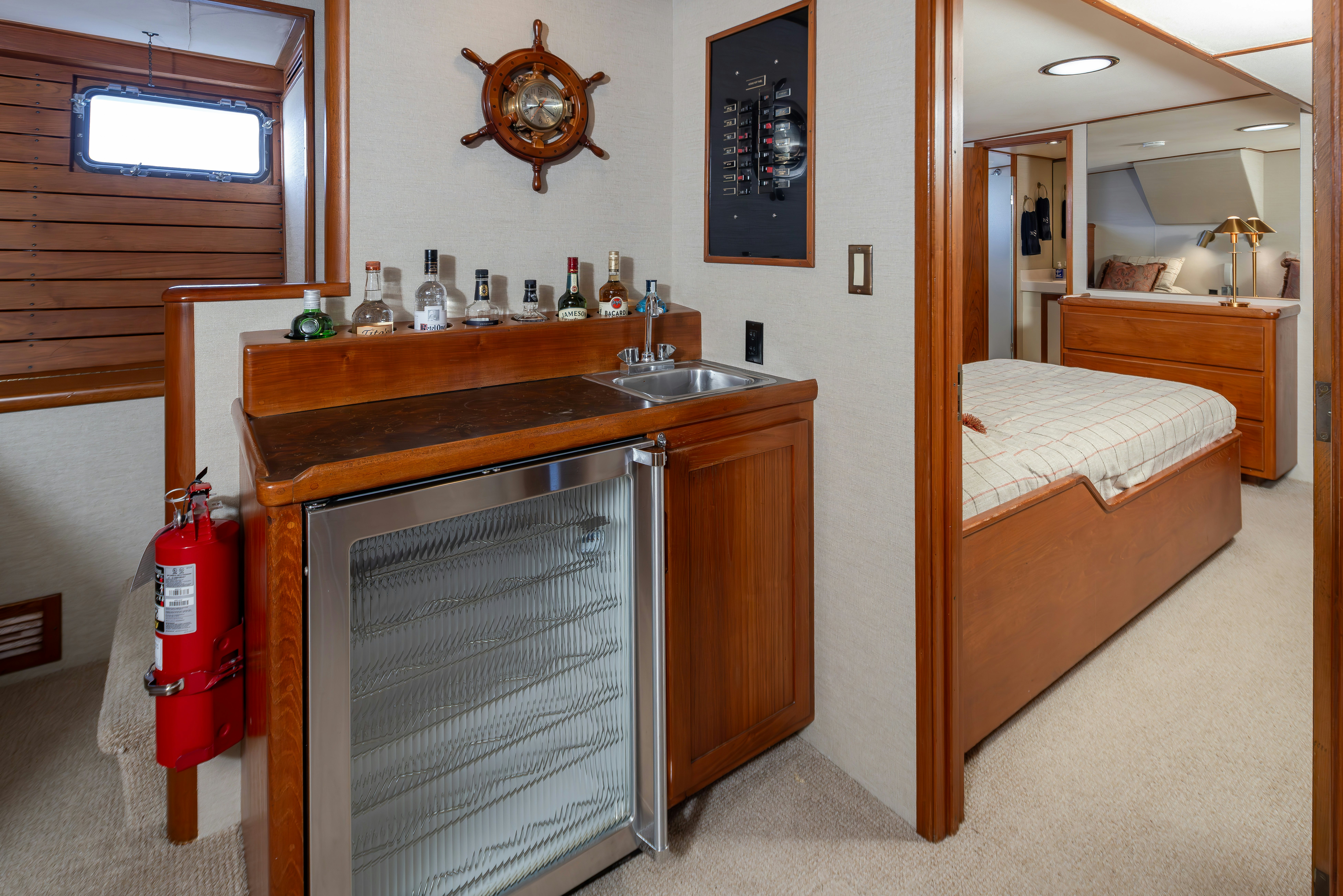 a kitchen with a sink and a bed aboard SILVERADO Yacht for Sale