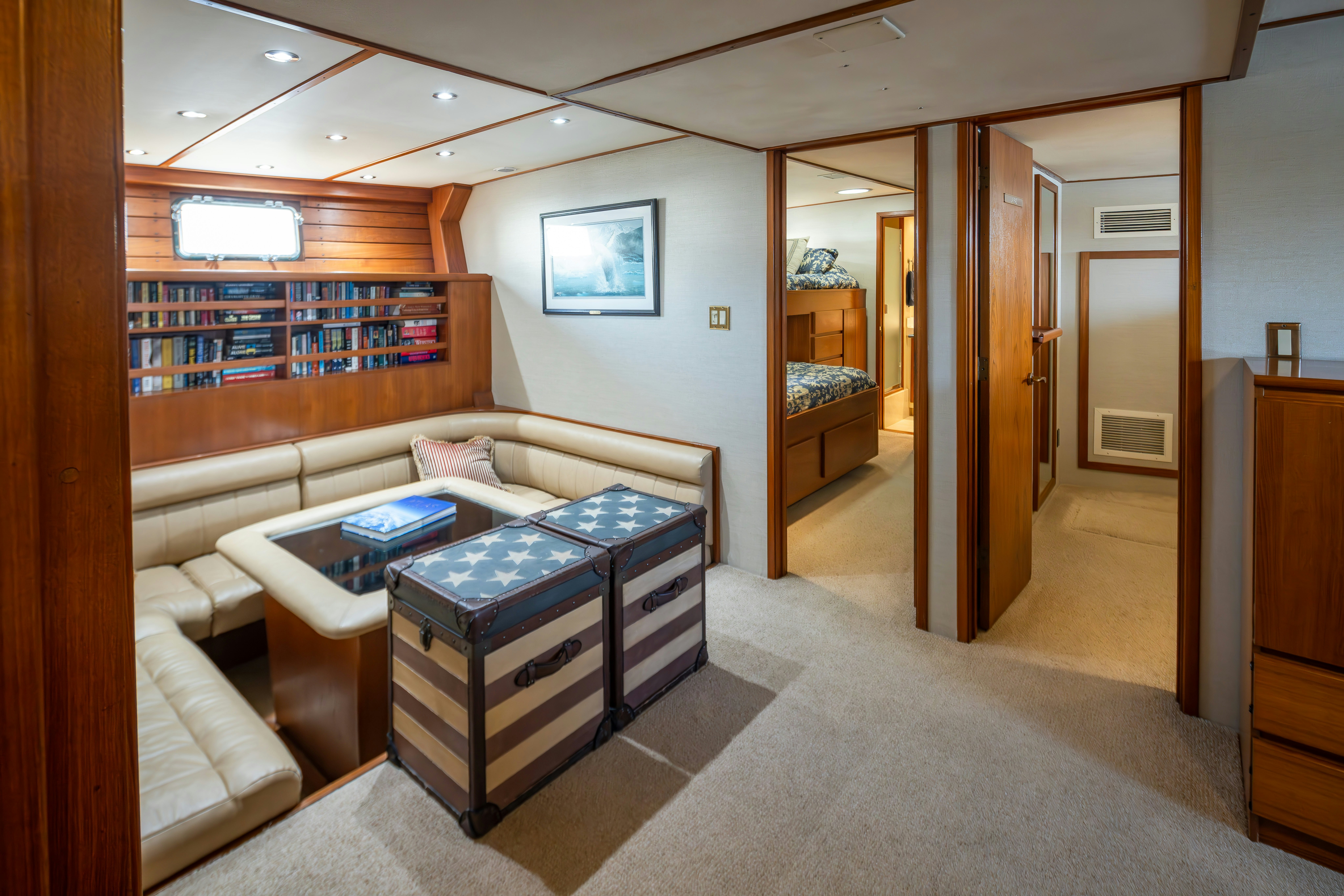 a room with a bed and a desk aboard SILVERADO Yacht for Sale