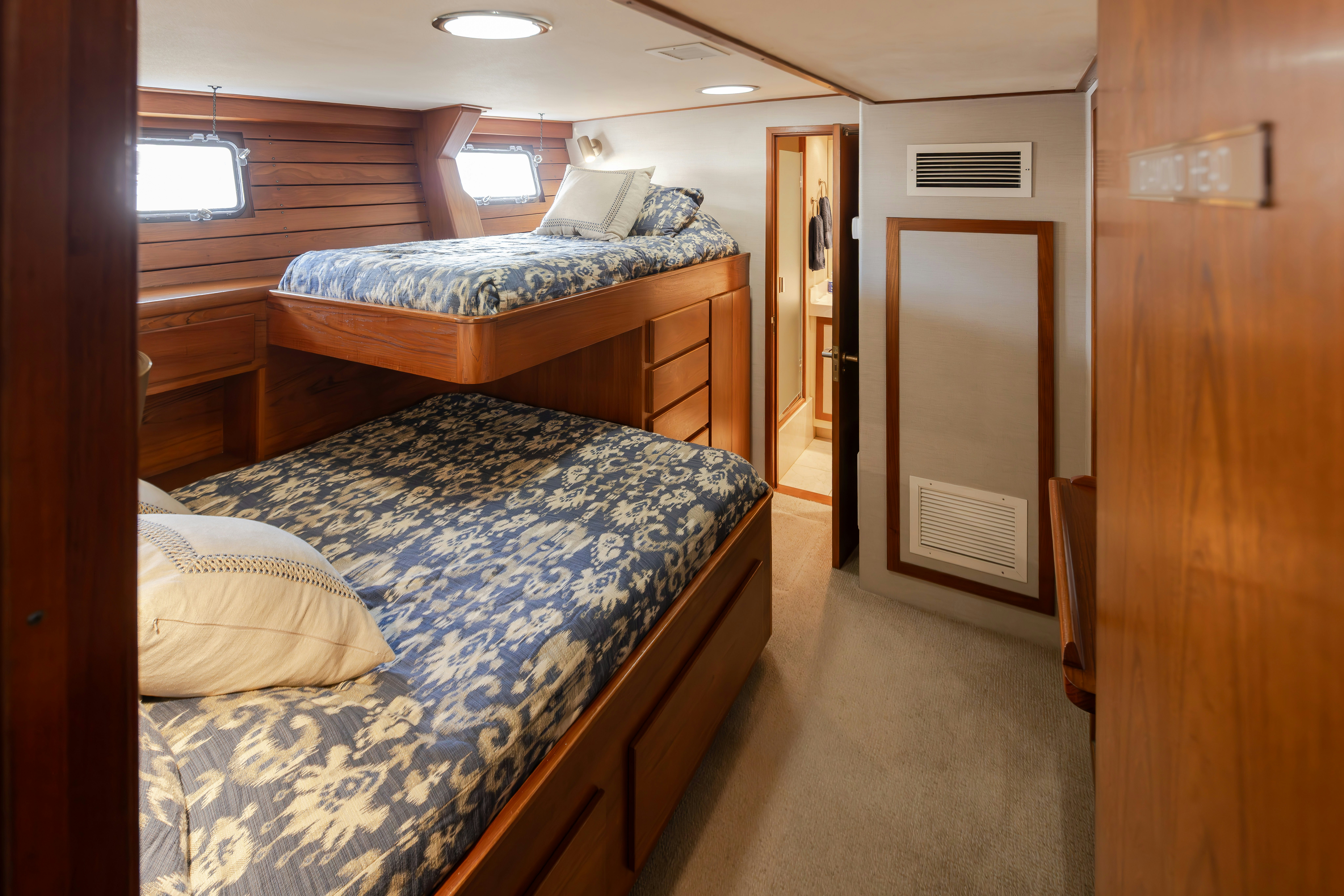 a bedroom with two beds aboard SILVERADO Yacht for Sale