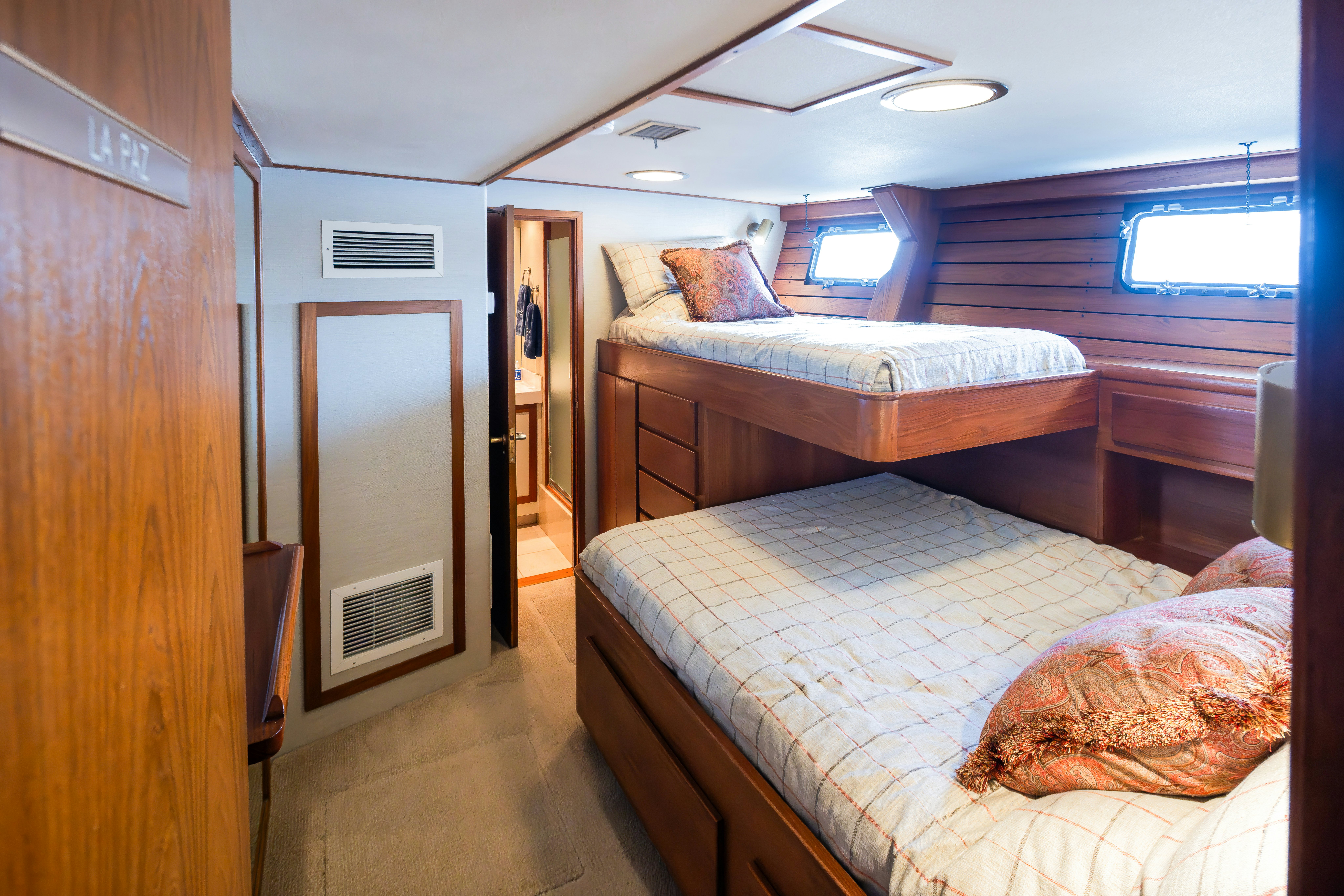 a couple of beds in a room aboard SILVERADO Yacht for Sale