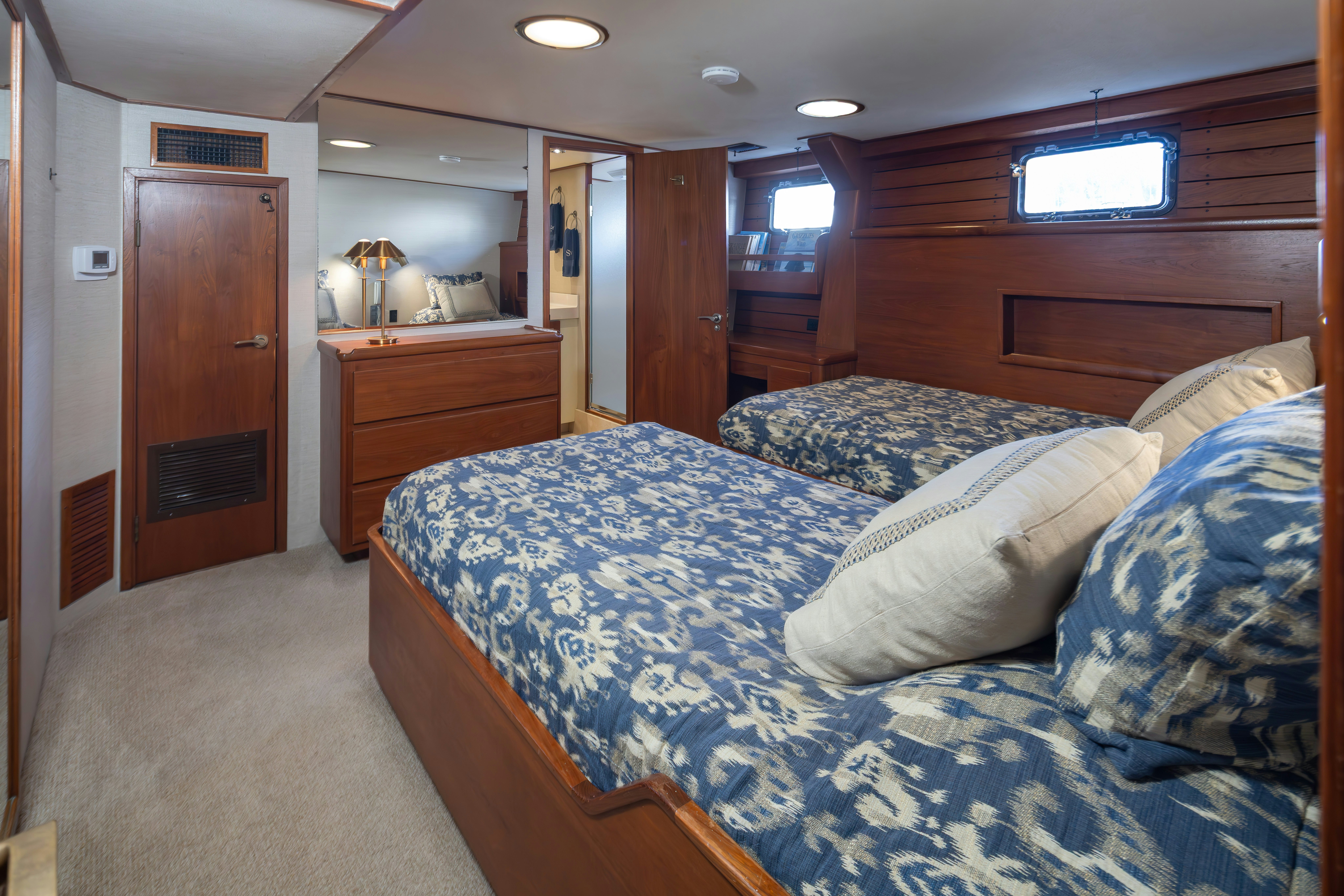 a bed in a room aboard SILVERADO Yacht for Sale