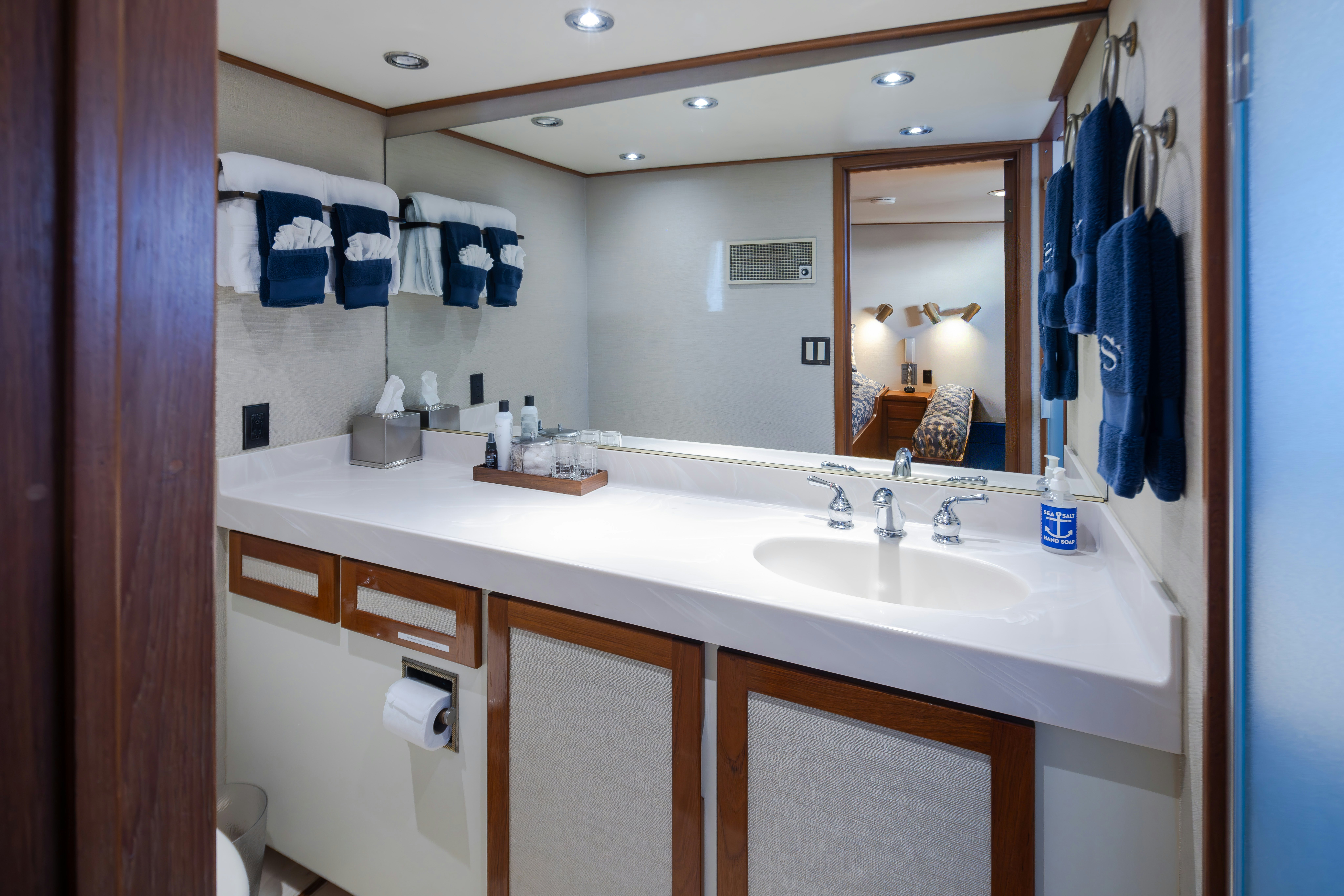 a bathroom with a sink and a mirror aboard SILVERADO Yacht for Sale