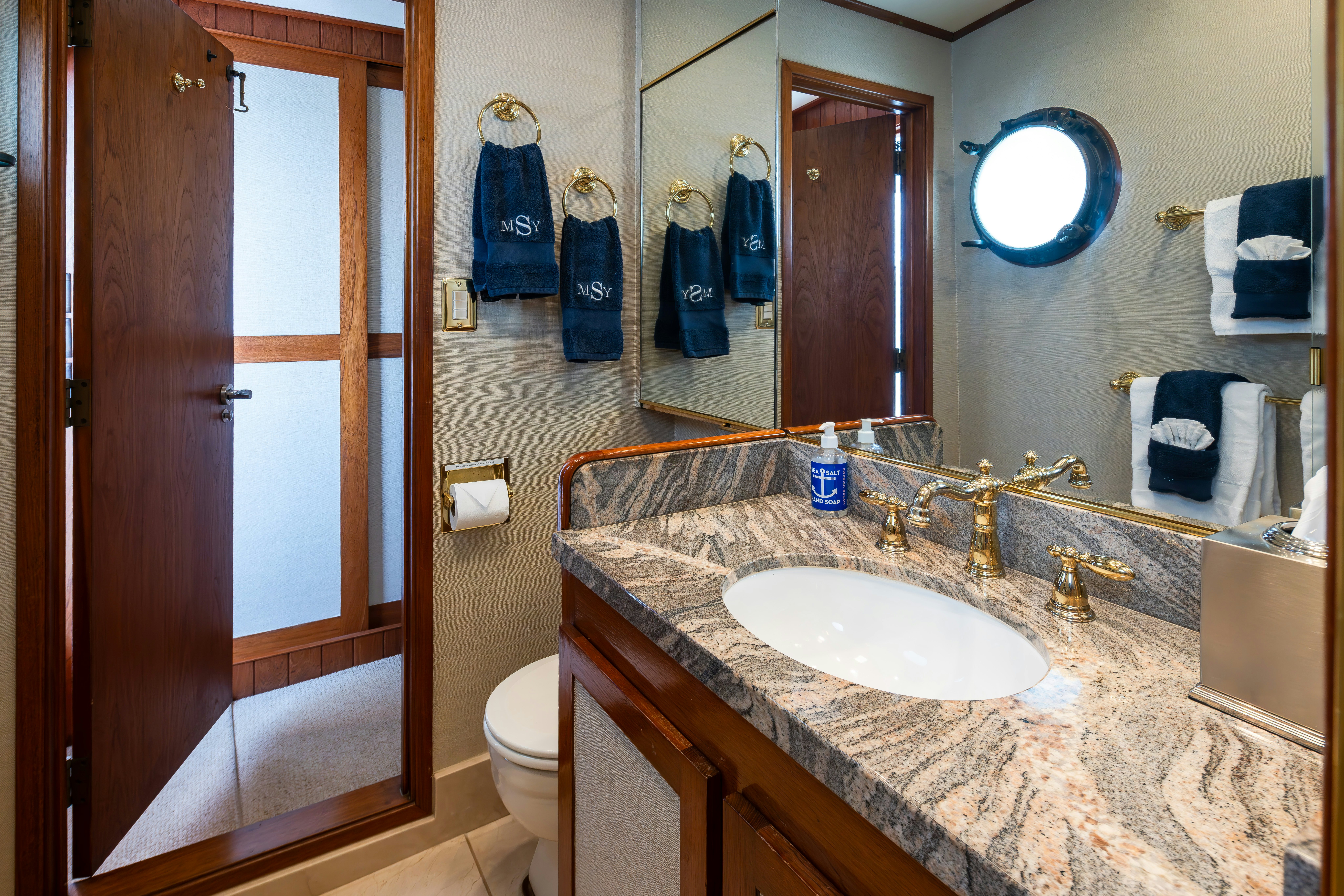 a bathroom with a sink and a toilet aboard SILVERADO Yacht for Sale