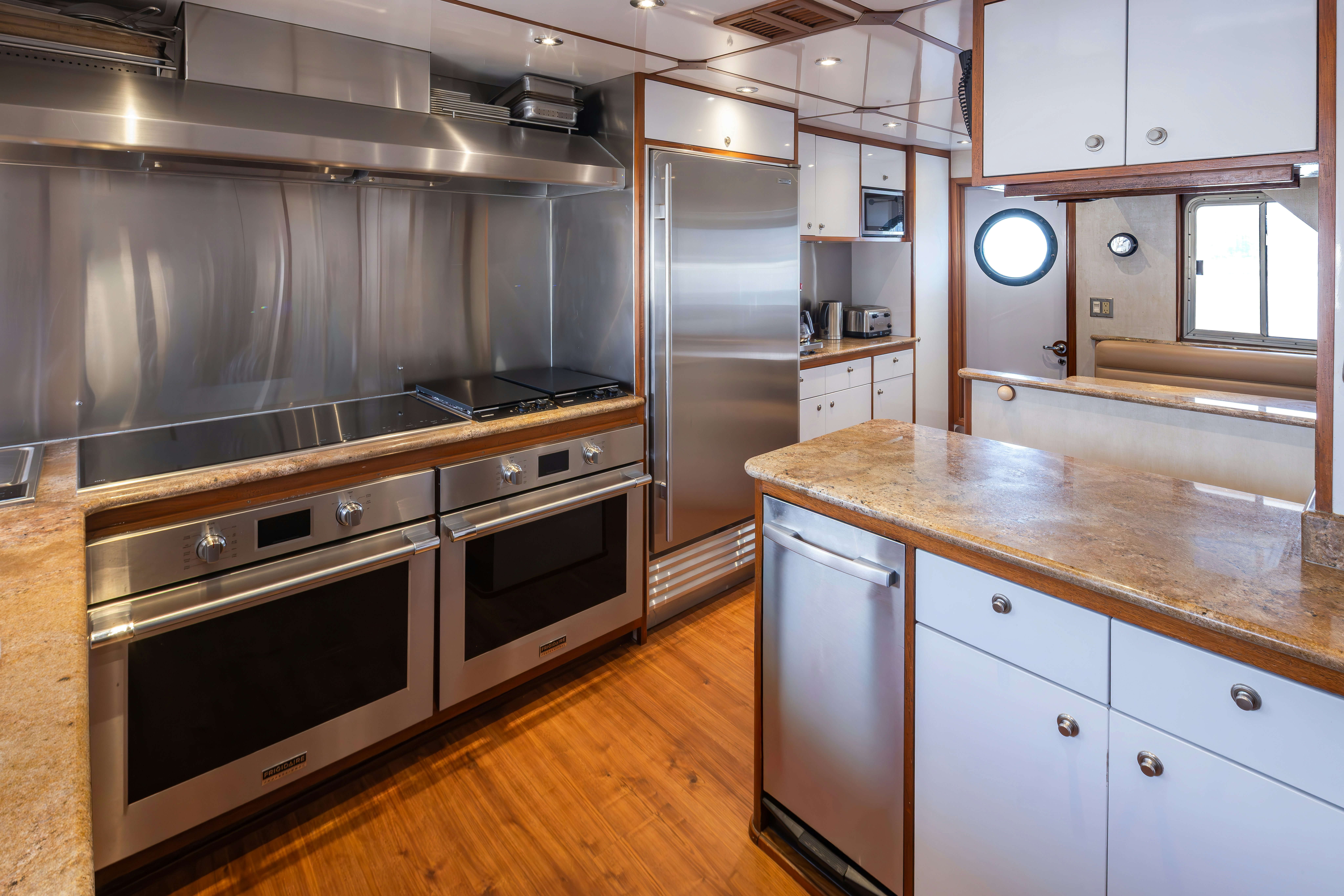 a kitchen with stainless steel appliances aboard SILVERADO Yacht for Sale