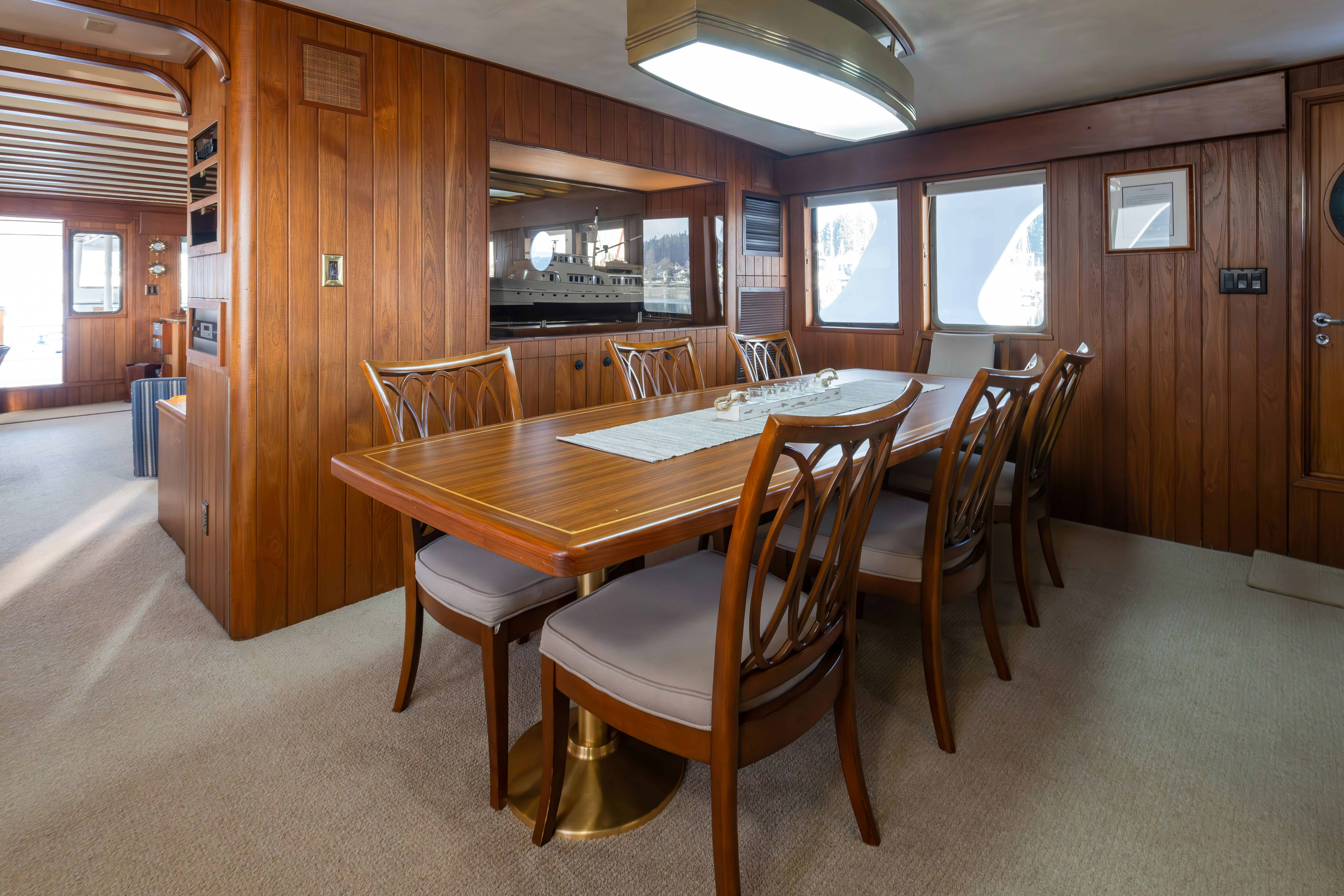 a dining table in a room aboard SILVERADO Yacht for Sale