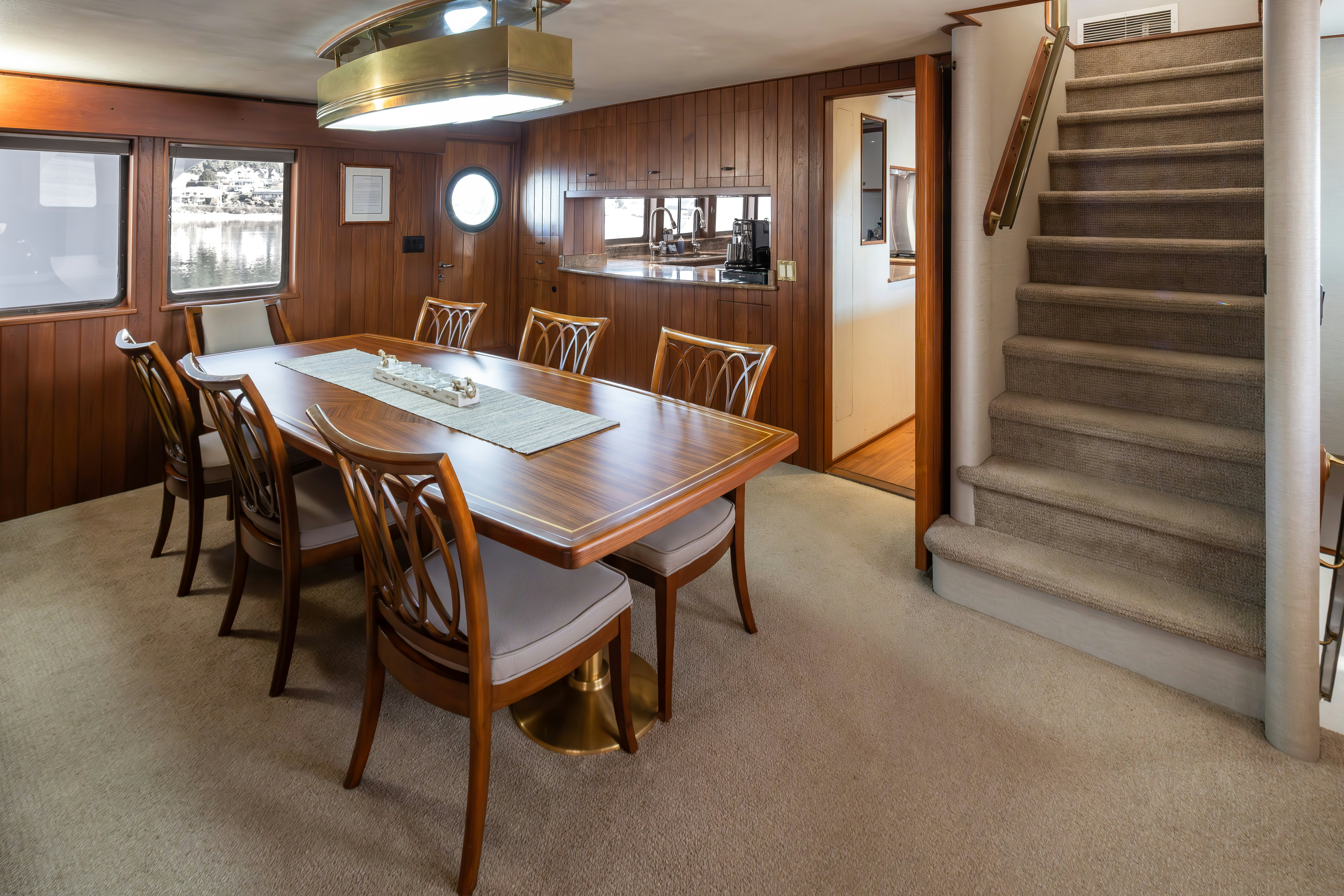 a dining table in a house aboard SILVERADO Yacht for Sale