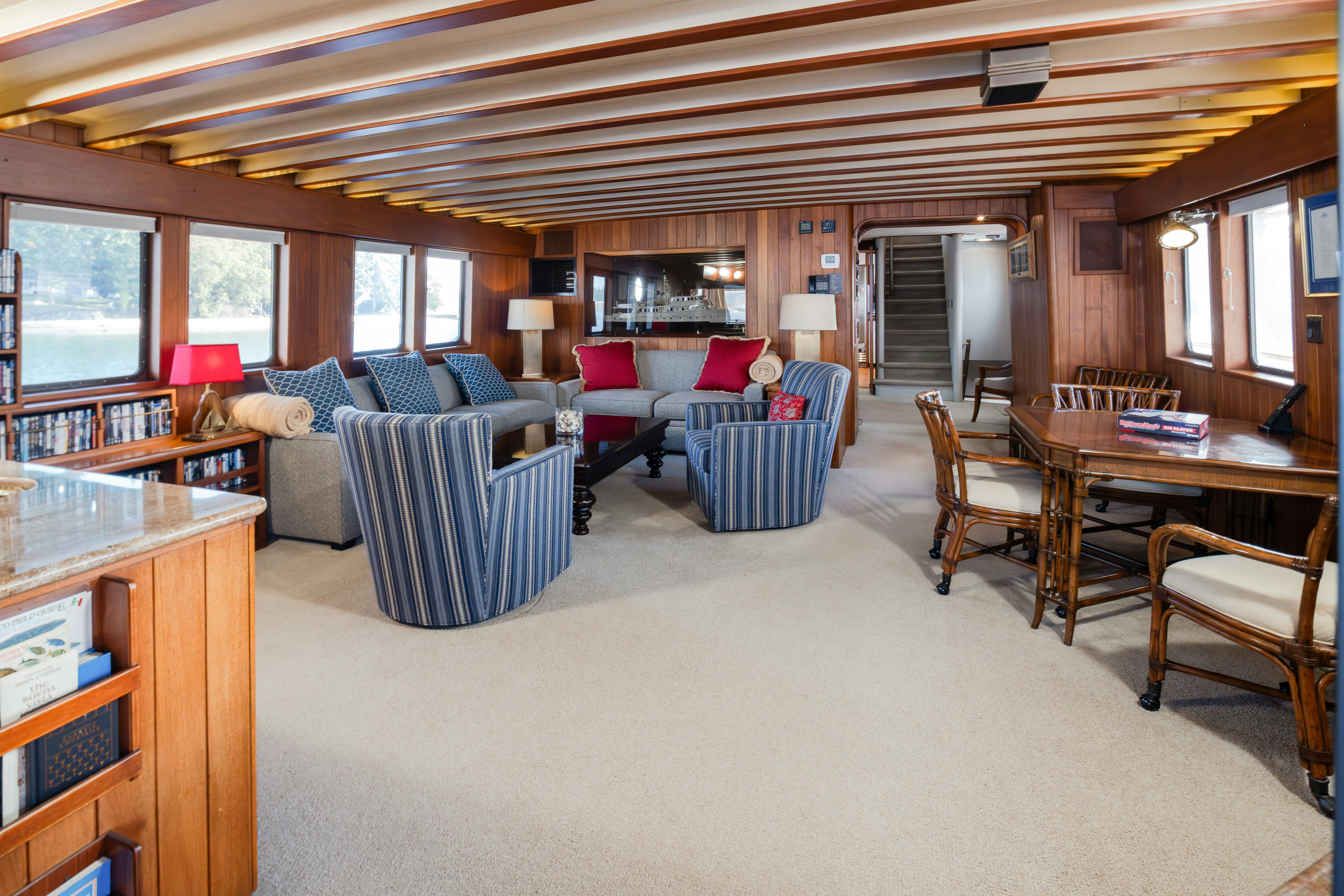 a living room with a couch and a table aboard SILVERADO Yacht for Sale