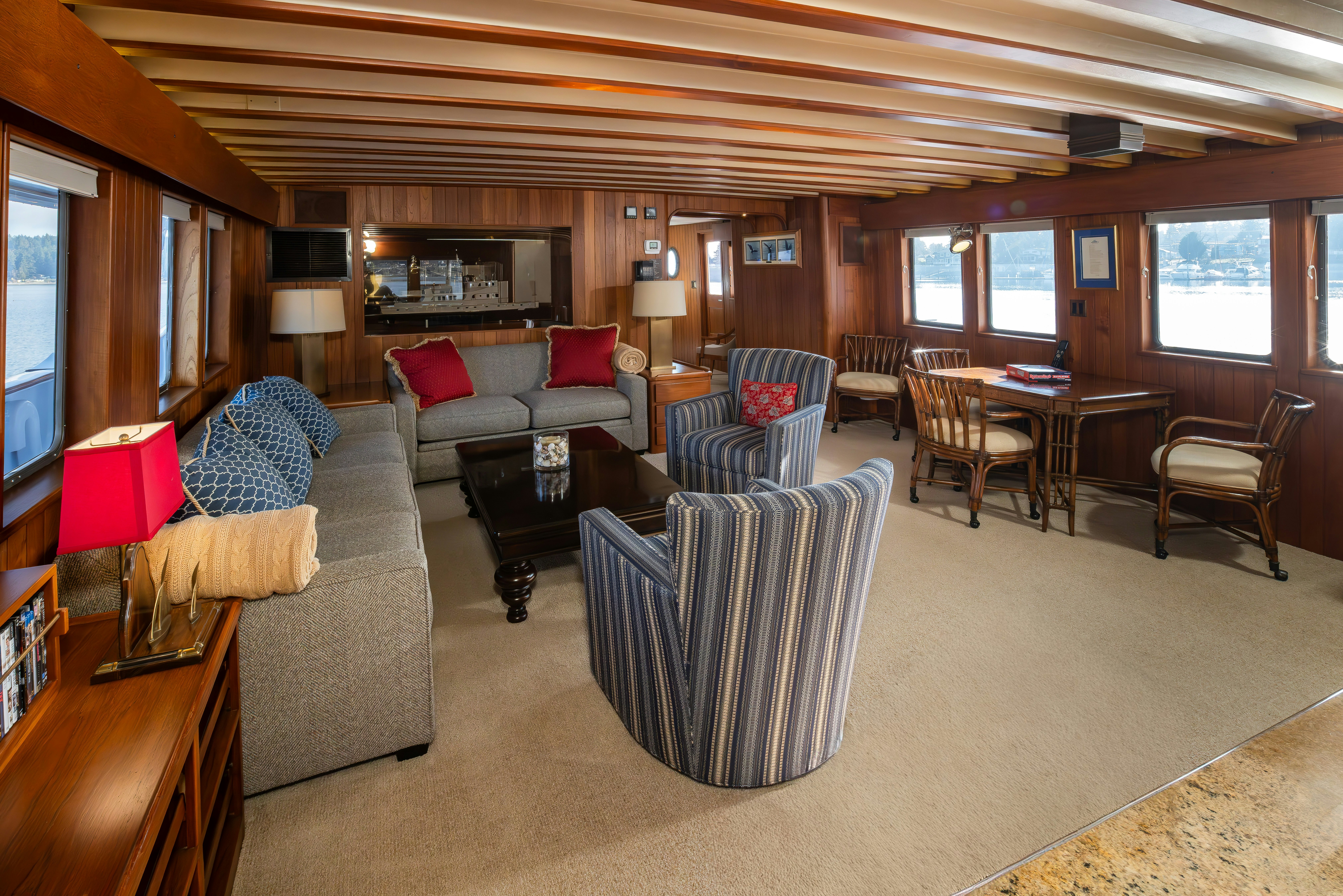 a living room with a large wood ceiling aboard SILVERADO Yacht for Sale