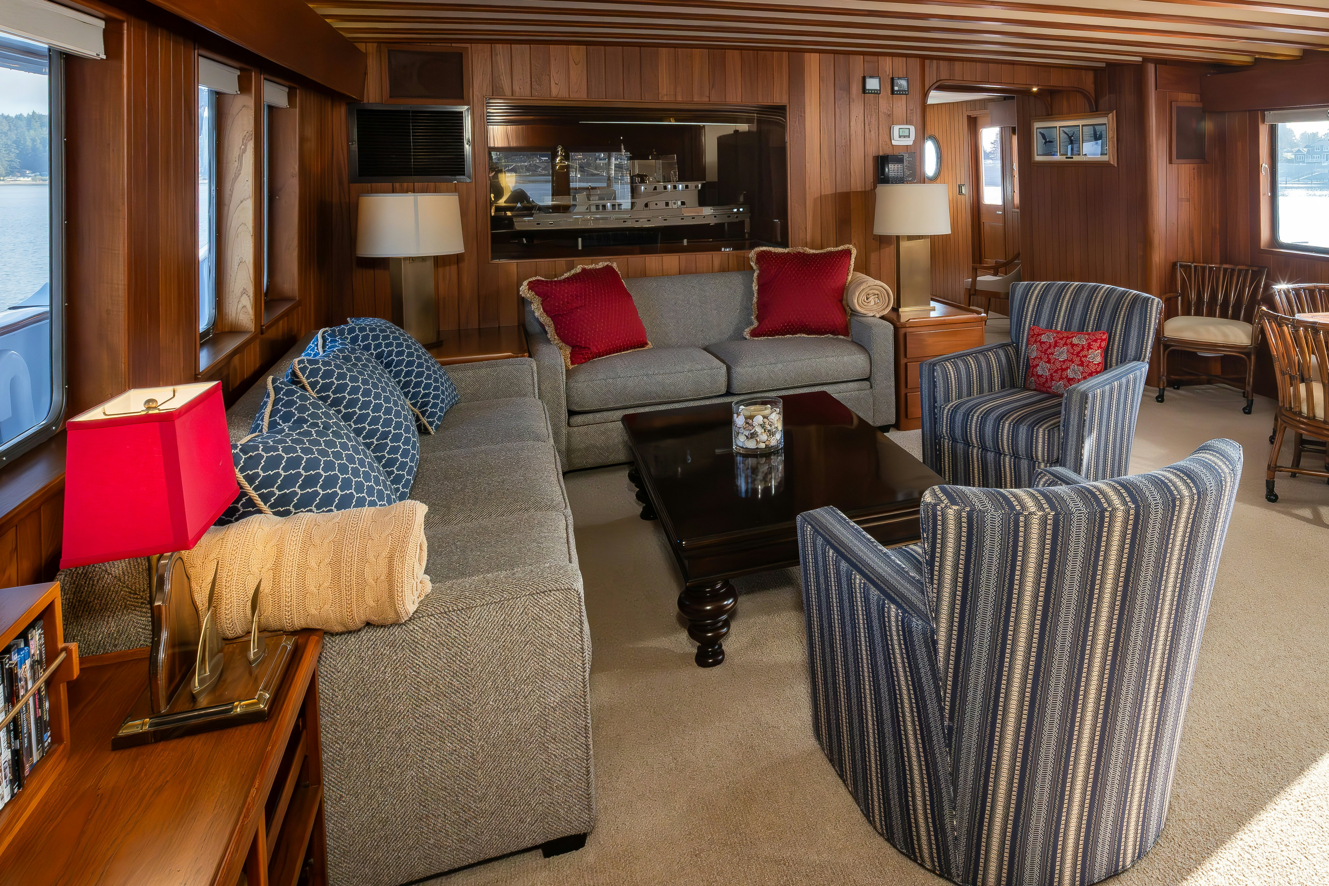 a living room with a couch and a table aboard SILVERADO Yacht for Sale