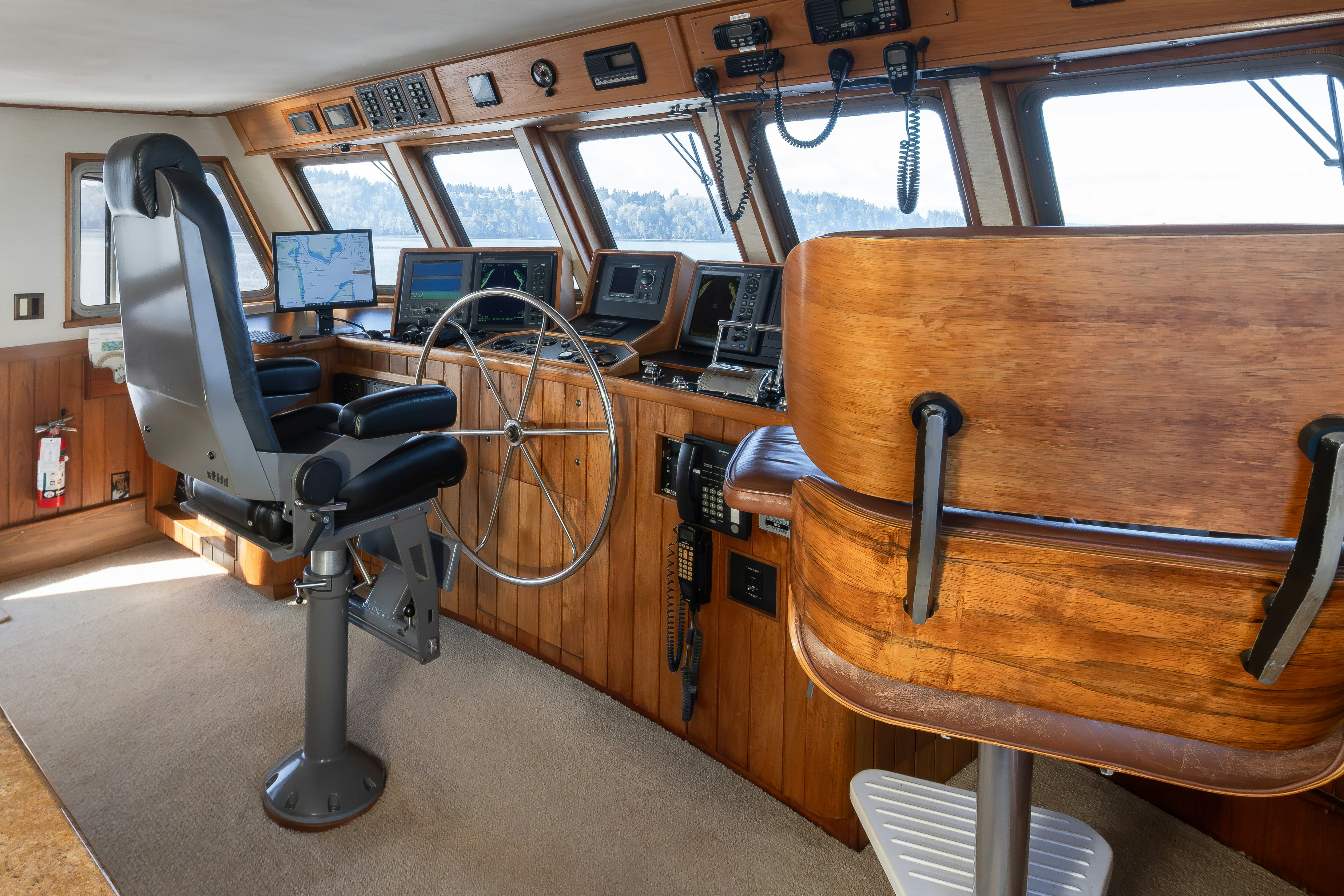 a room with a desk and chairs aboard SILVERADO Yacht for Sale