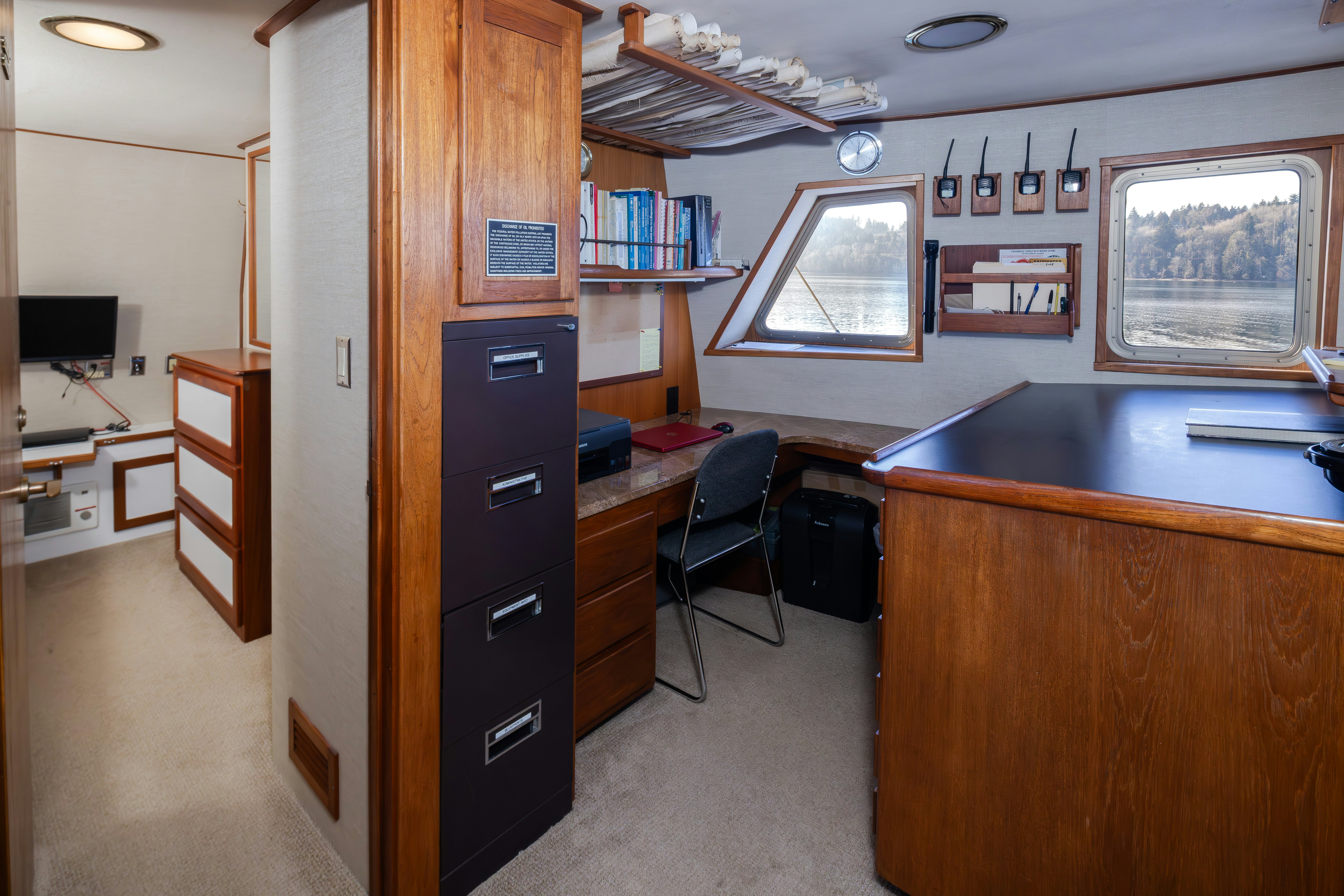 a room with a desk and a chair aboard SILVERADO Yacht for Sale