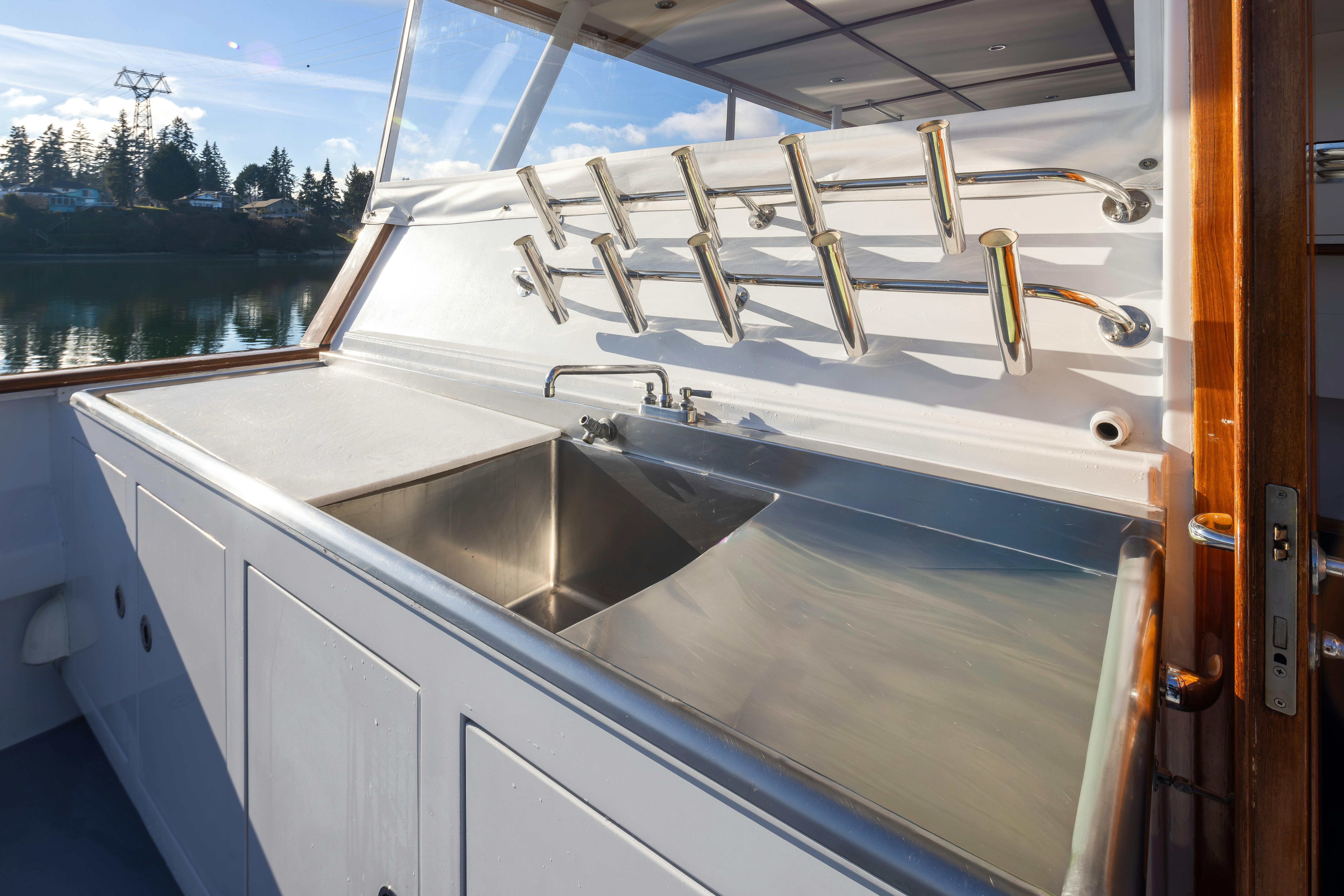 a white boat with a sink aboard SILVERADO Yacht for Sale