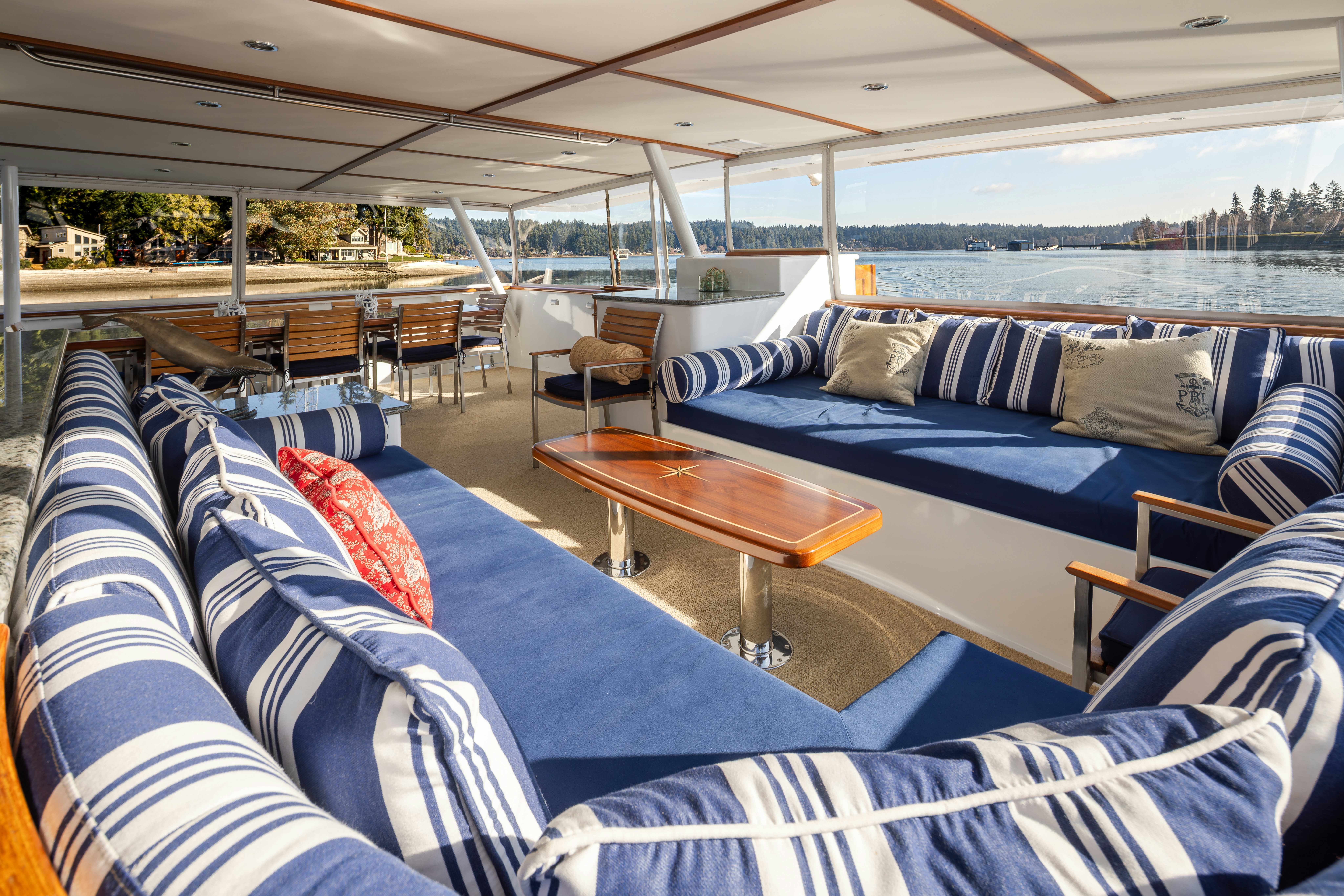 a room with a table and chairs aboard SILVERADO Yacht for Sale