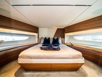 a pair of shoes on a bed aboard RECORD YEAR Yacht for Charter