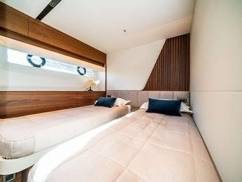 a room with two beds aboard RECORD YEAR Yacht for Charter