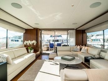 a living room with a large window aboard RECORD YEAR Yacht for Charter