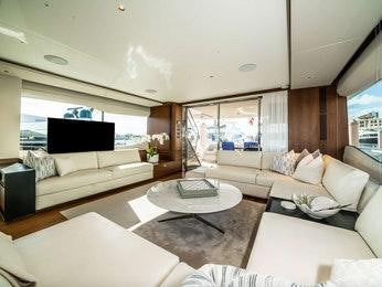 a living room with a large window aboard RECORD YEAR Yacht for Charter