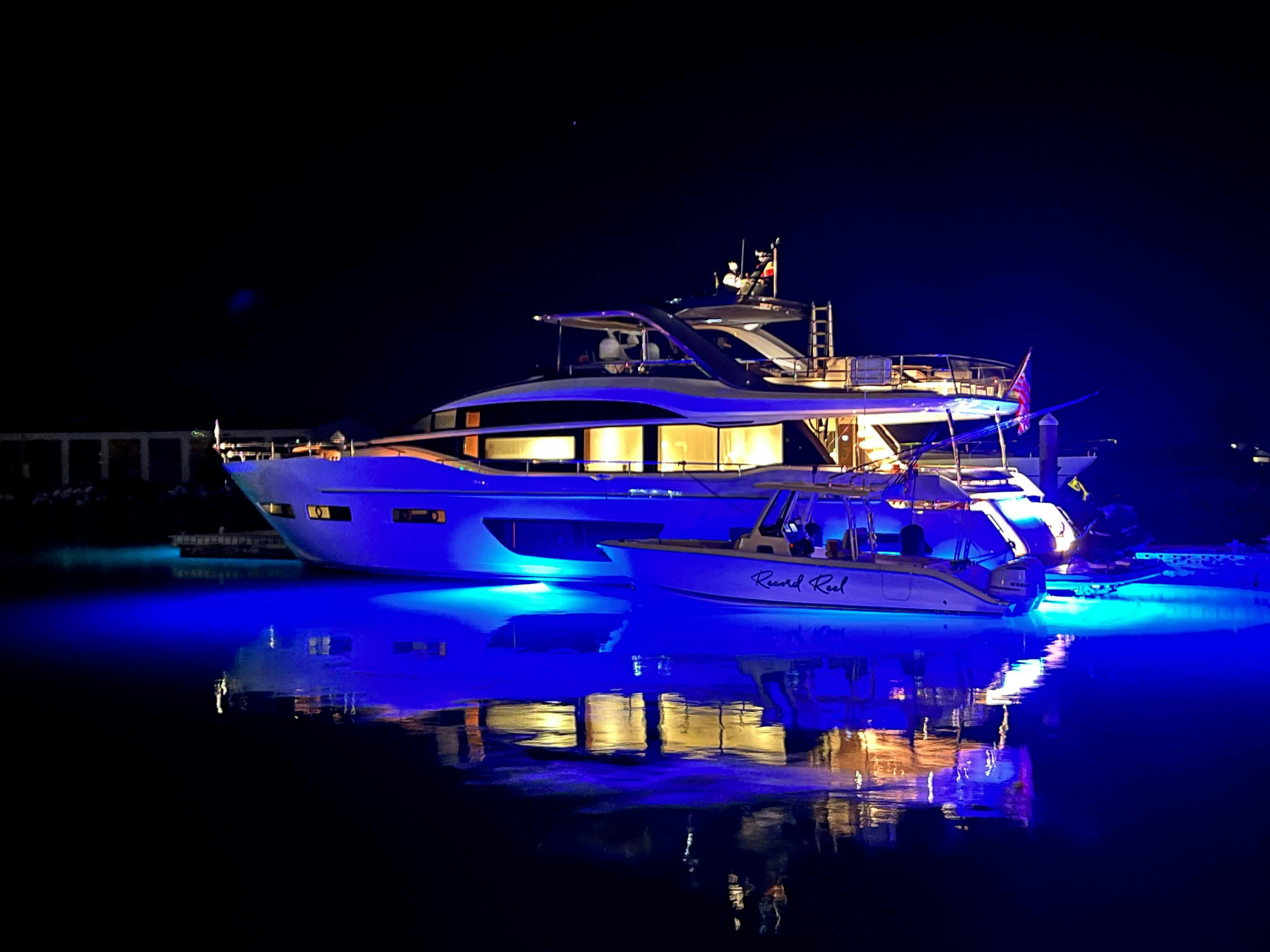 a couple of boats on the water aboard RECORD YEAR Yacht for Charter
