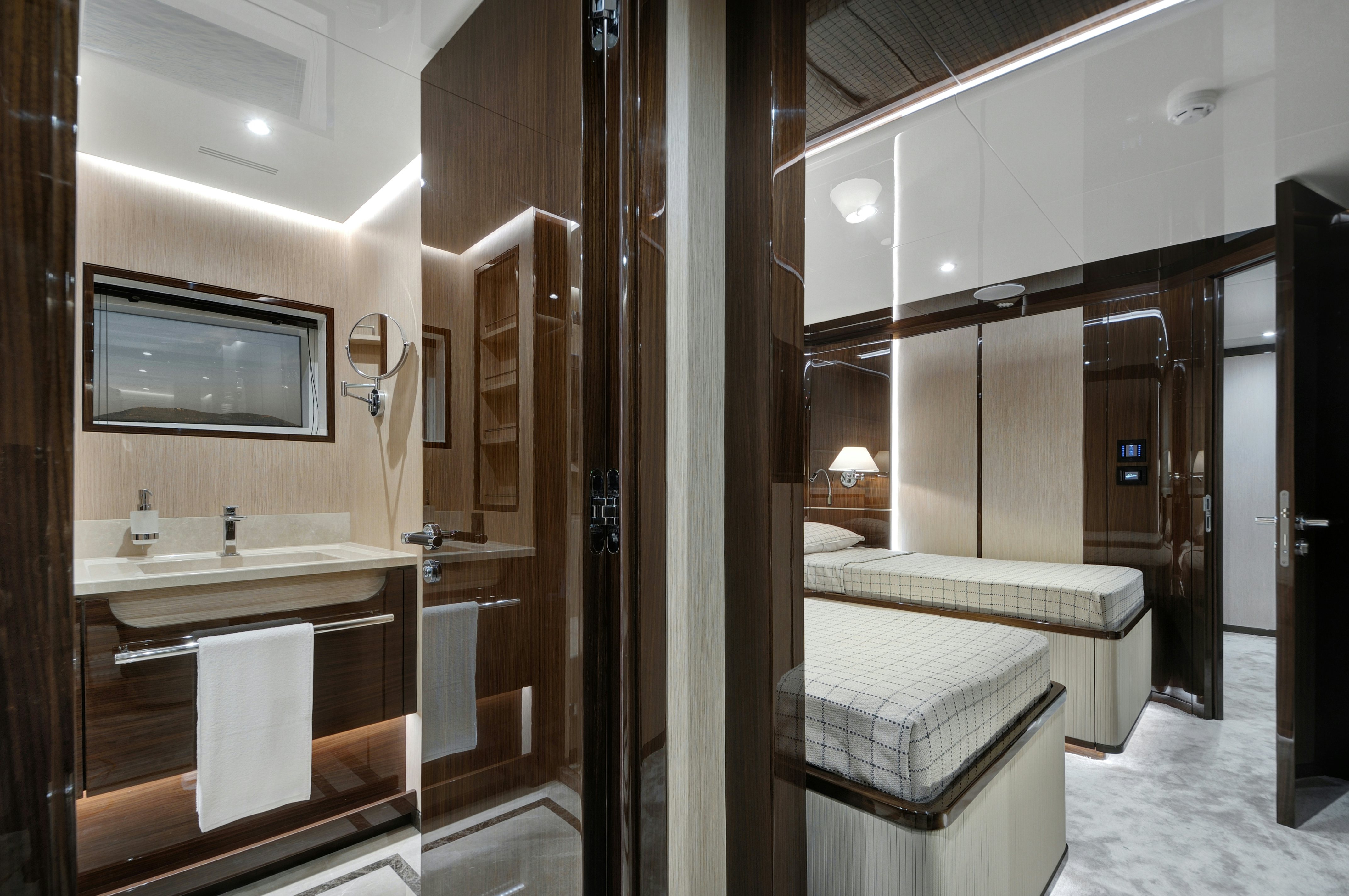 a bathroom with a large mirror aboard LAZZARA UHV 100 Yacht for Sale