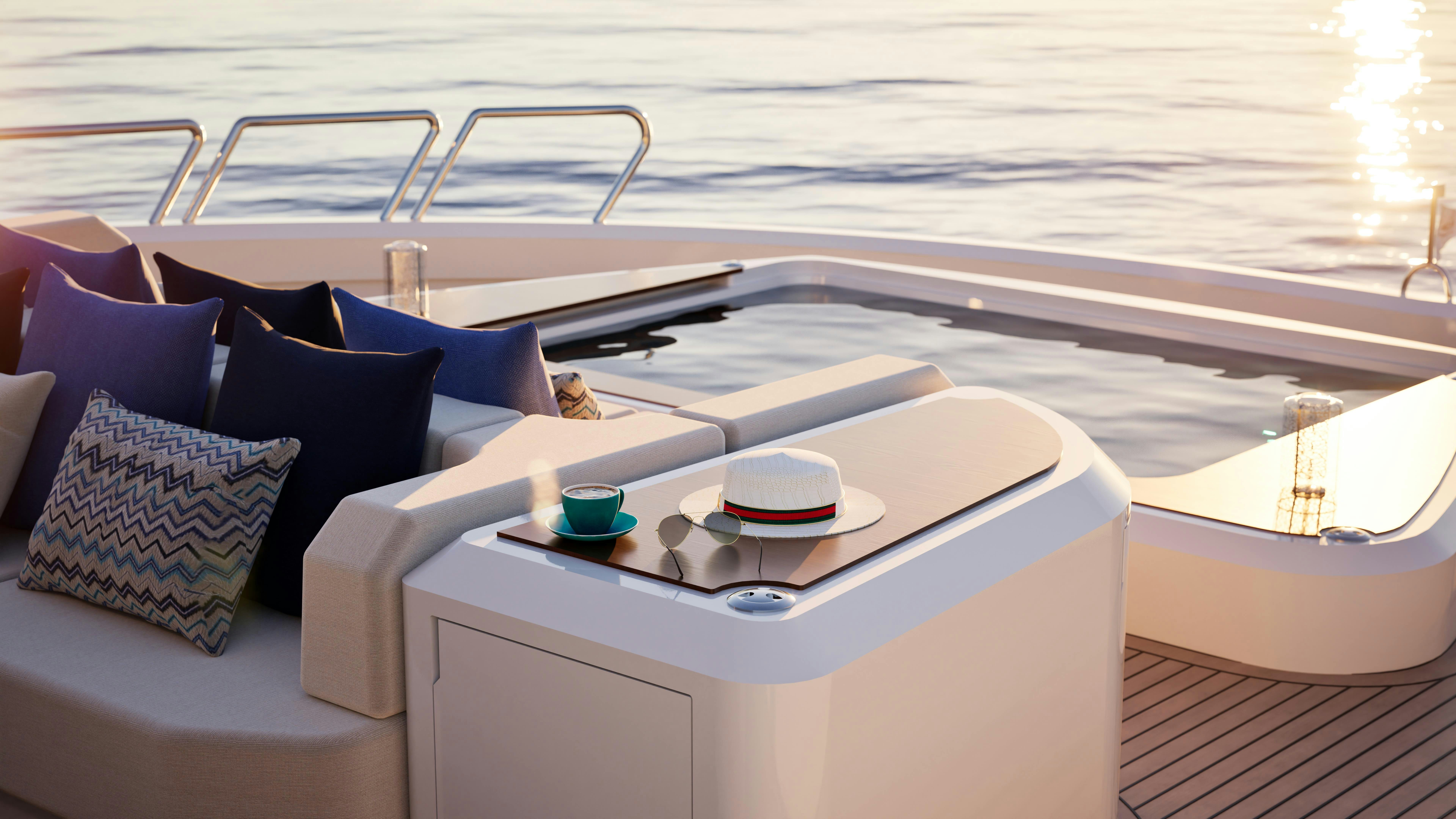 a white boat with a white table and blue pillows on it aboard LAZZARA UHV 100 Yacht for Sale