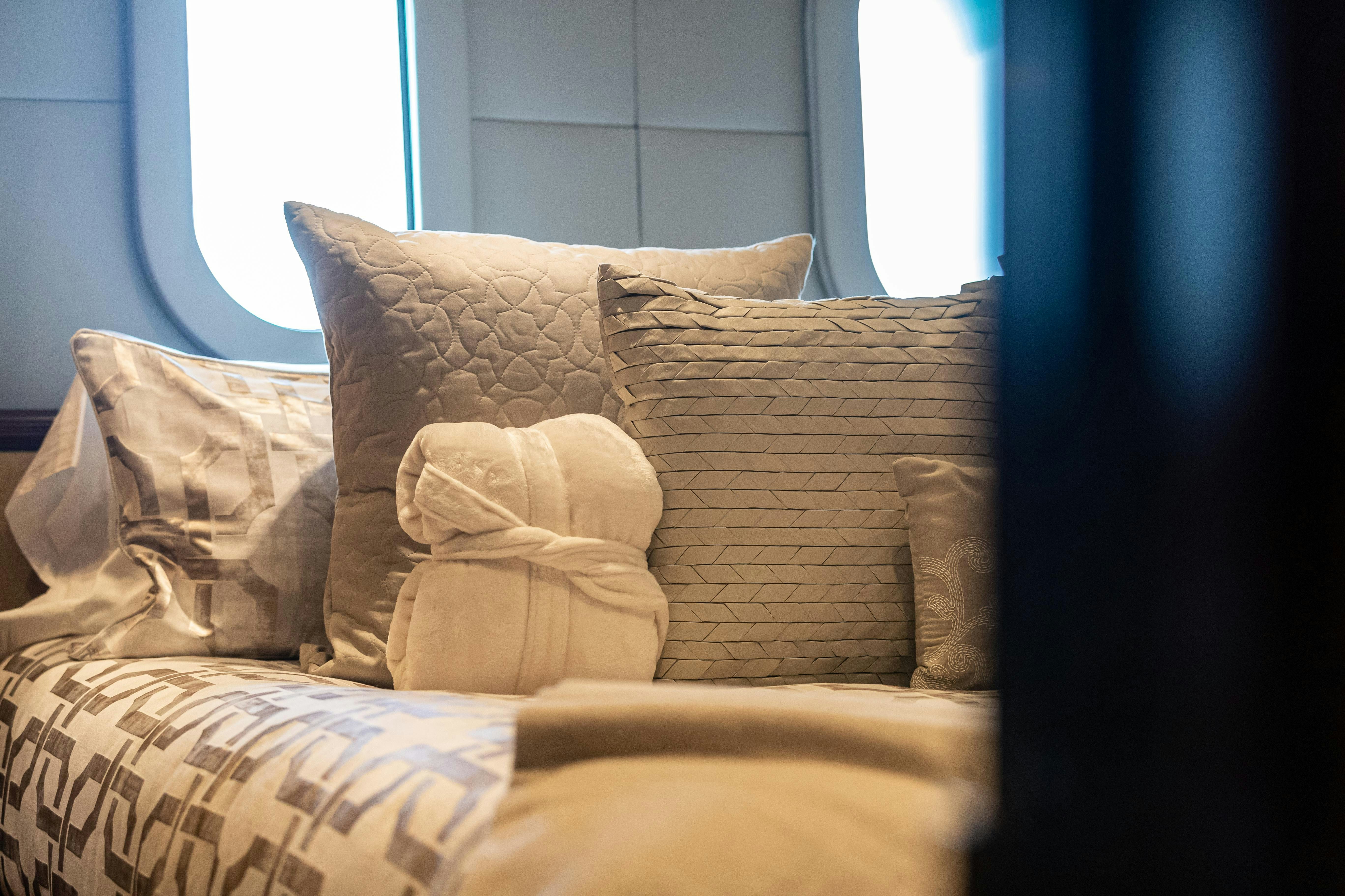 a bed with pillows aboard MISS STEPHANIE Yacht for Charter