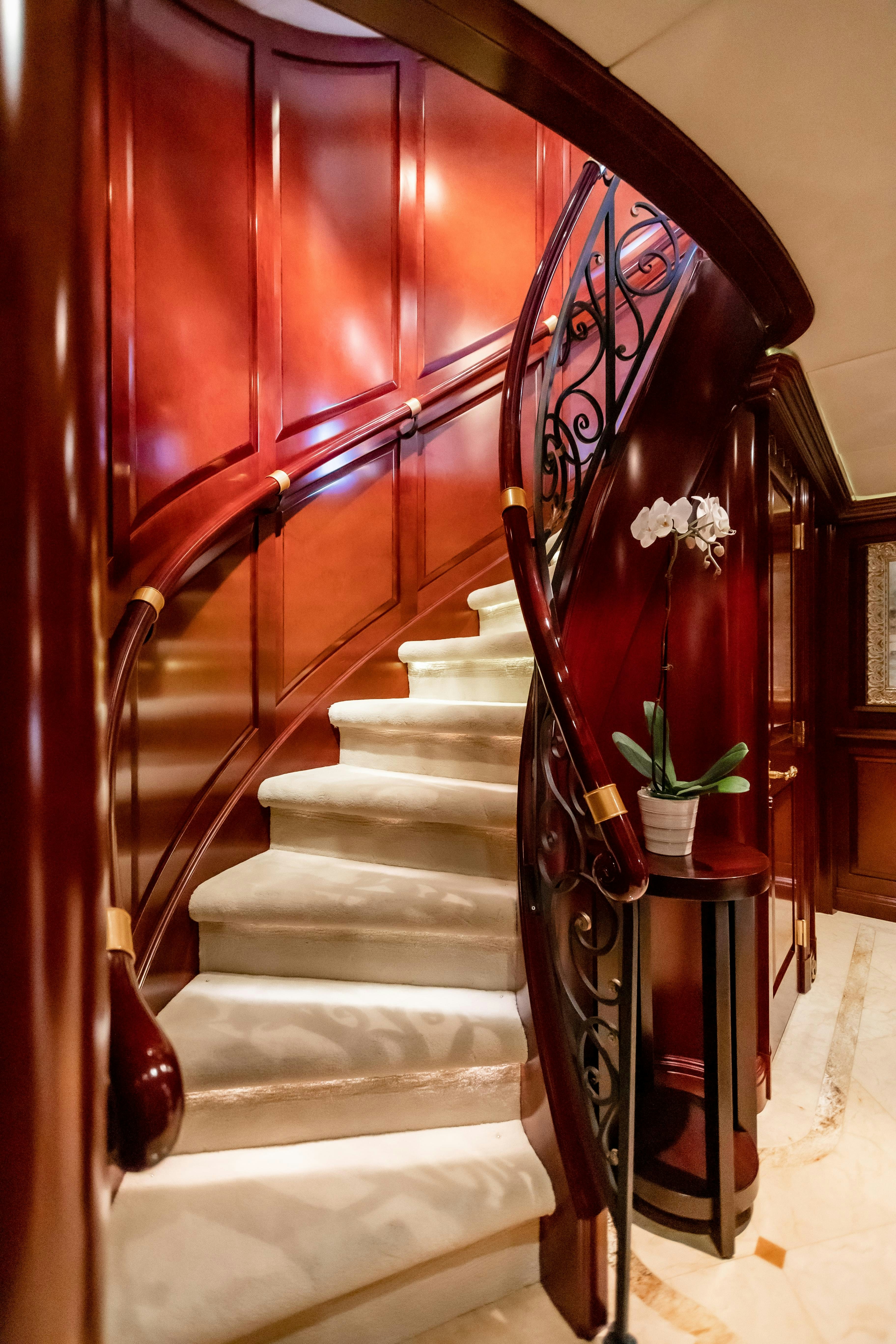 a red and black staircase aboard MISS STEPHANIE Yacht for Charter