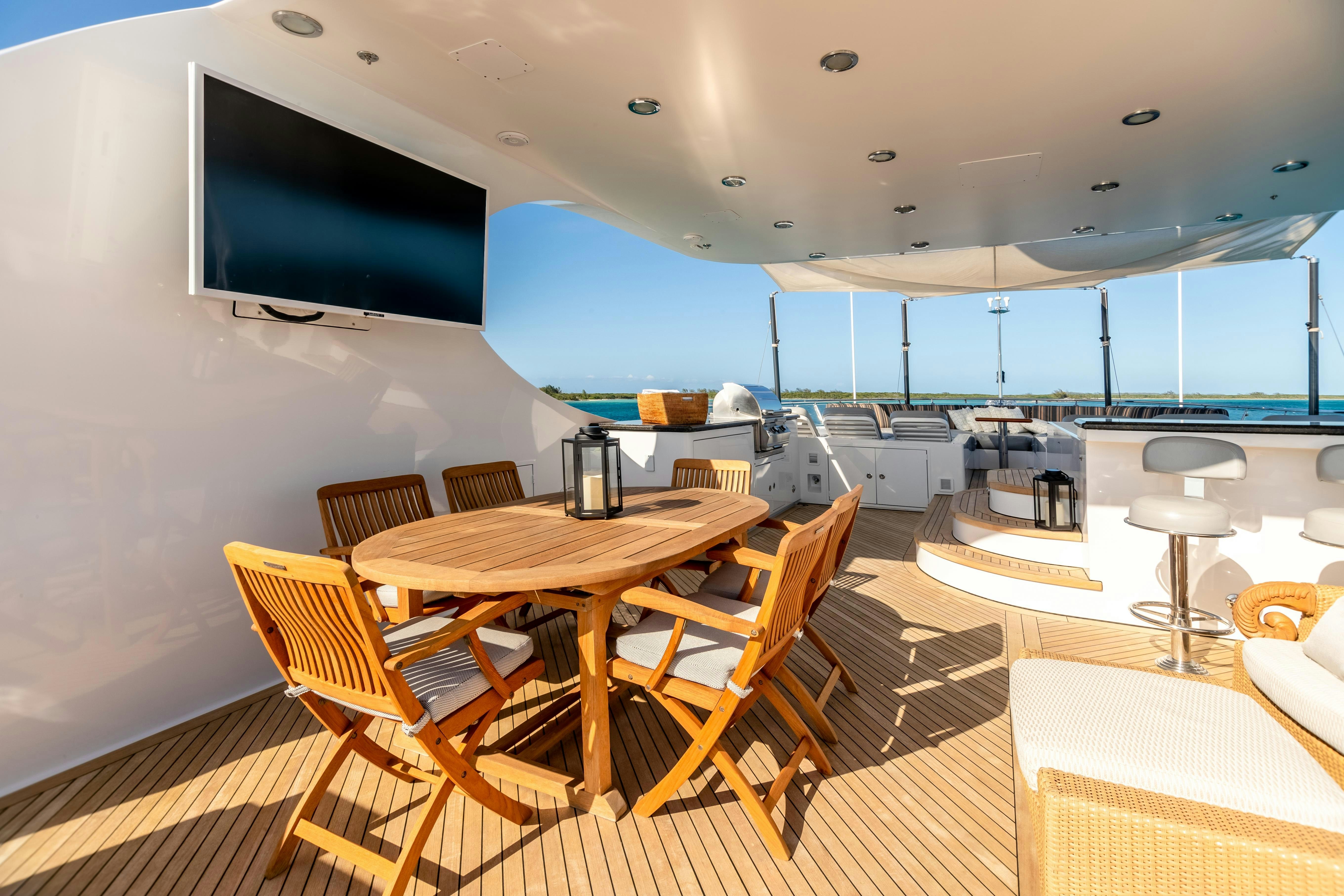 a room with a table and chairs aboard MISS STEPHANIE Yacht for Charter