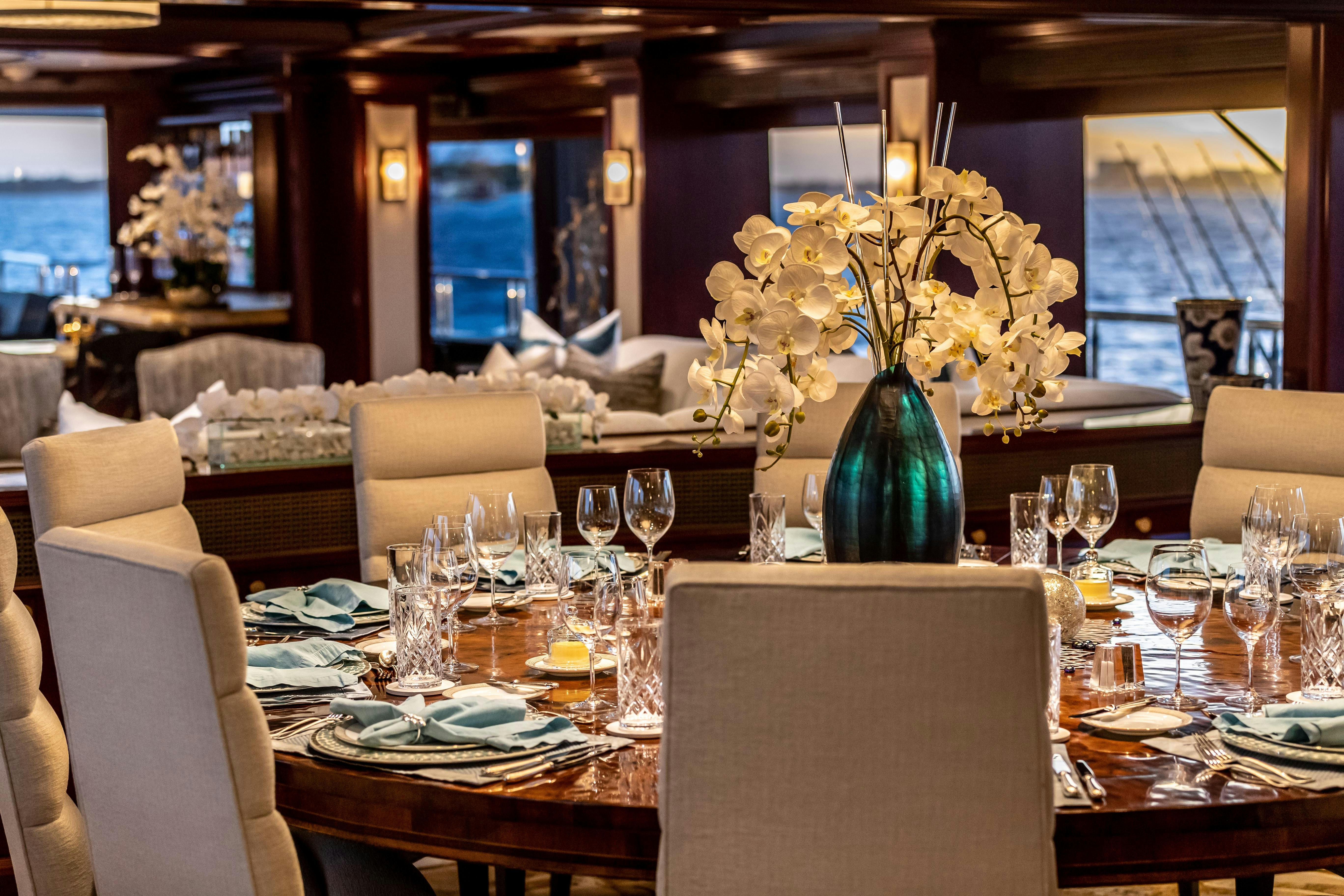 a table set with dinnerware aboard MISS STEPHANIE Yacht for Charter