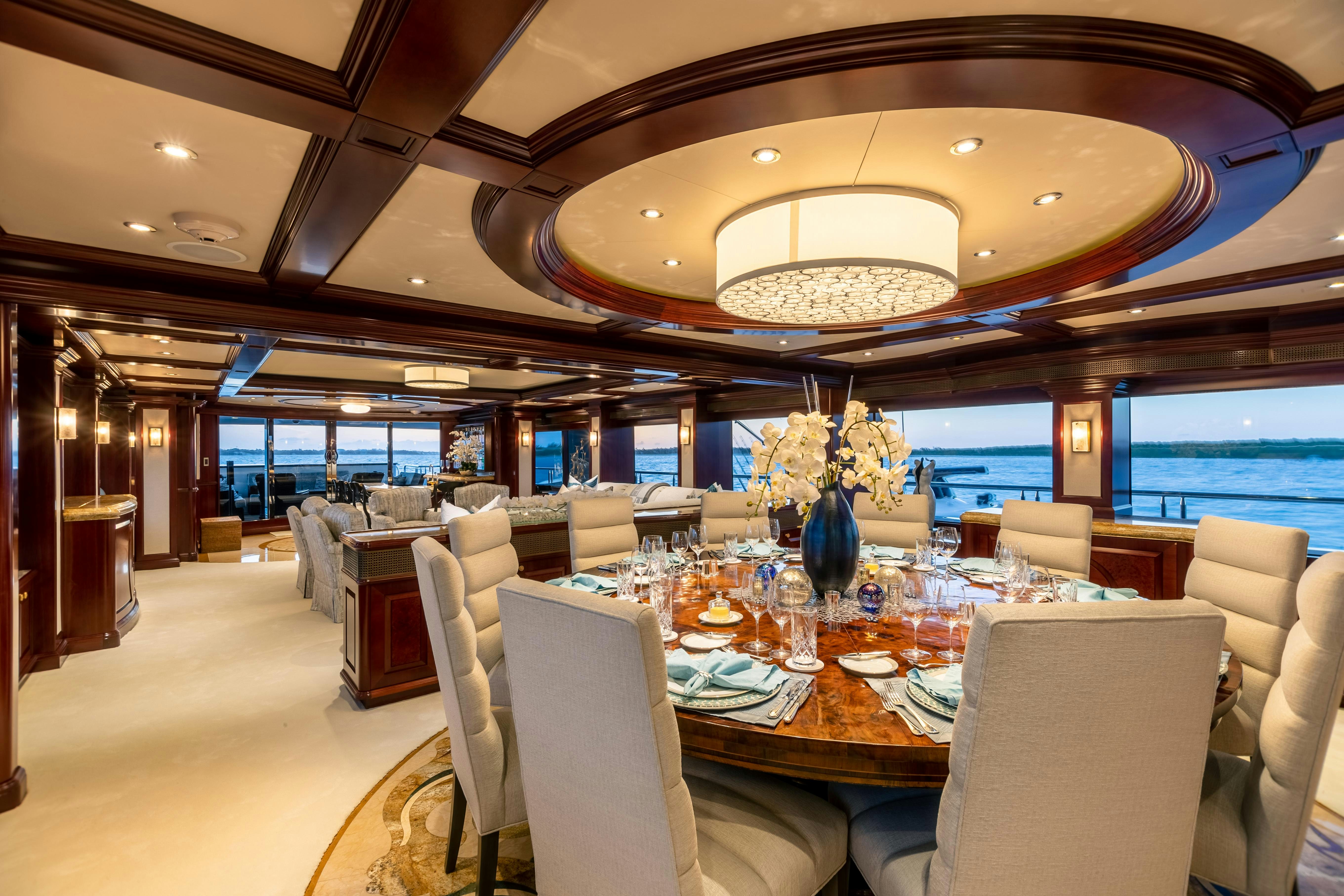 a room with tables and chairs aboard MISS STEPHANIE Yacht for Charter