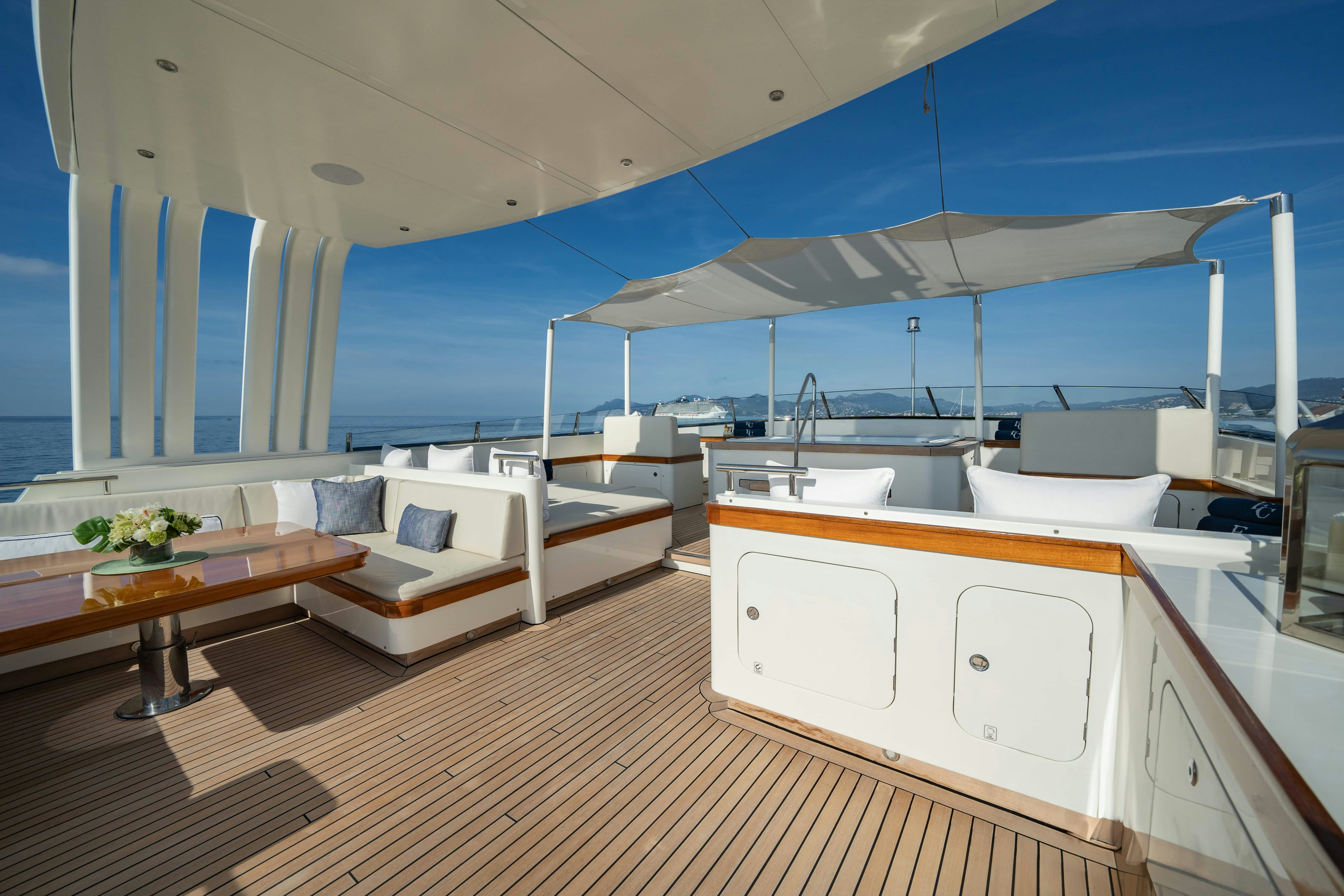 a room with a bed and a table aboard FABULOUS CHARACTER Yacht for Charter