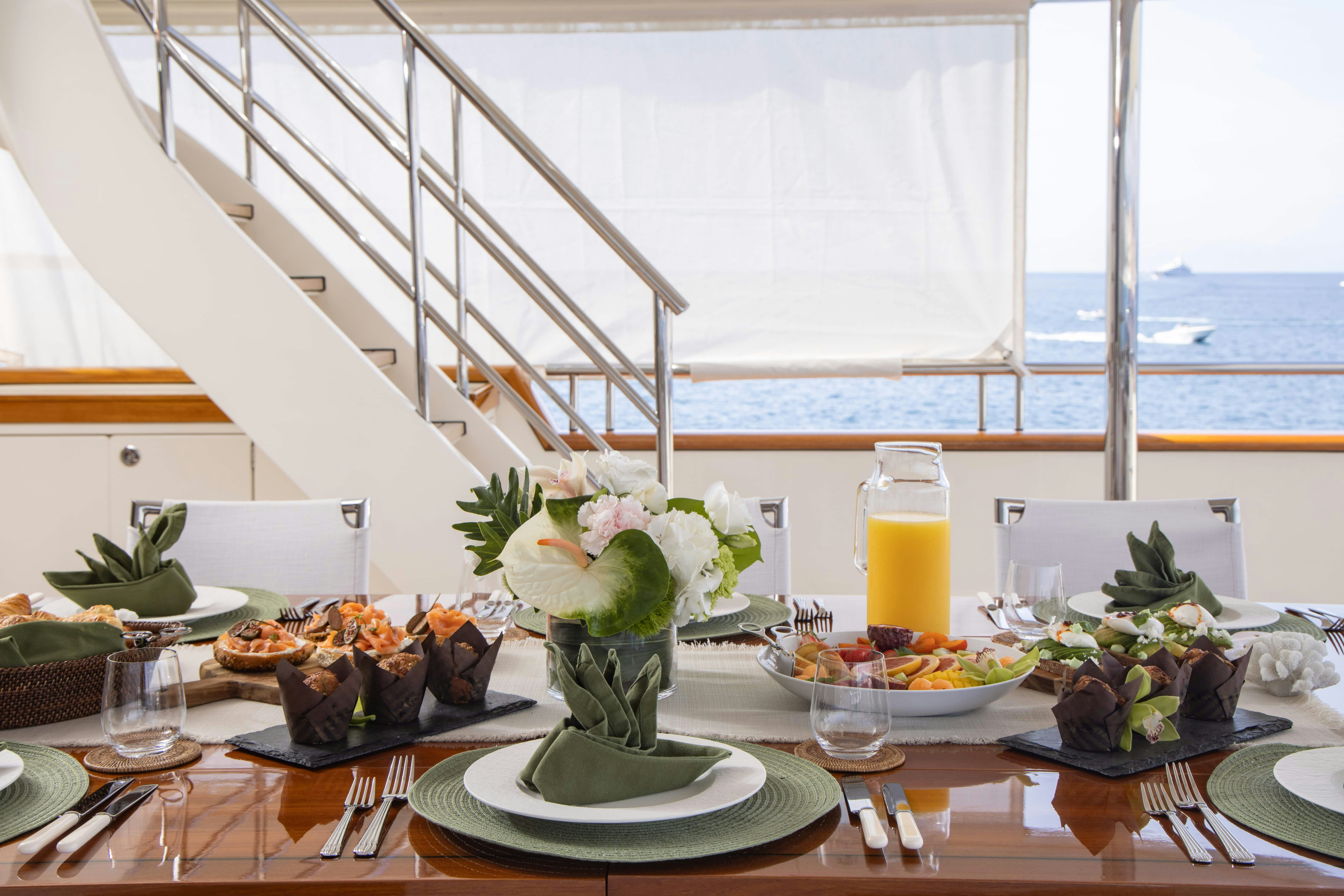 a table with food and drinks aboard FABULOUS CHARACTER Yacht for Charter