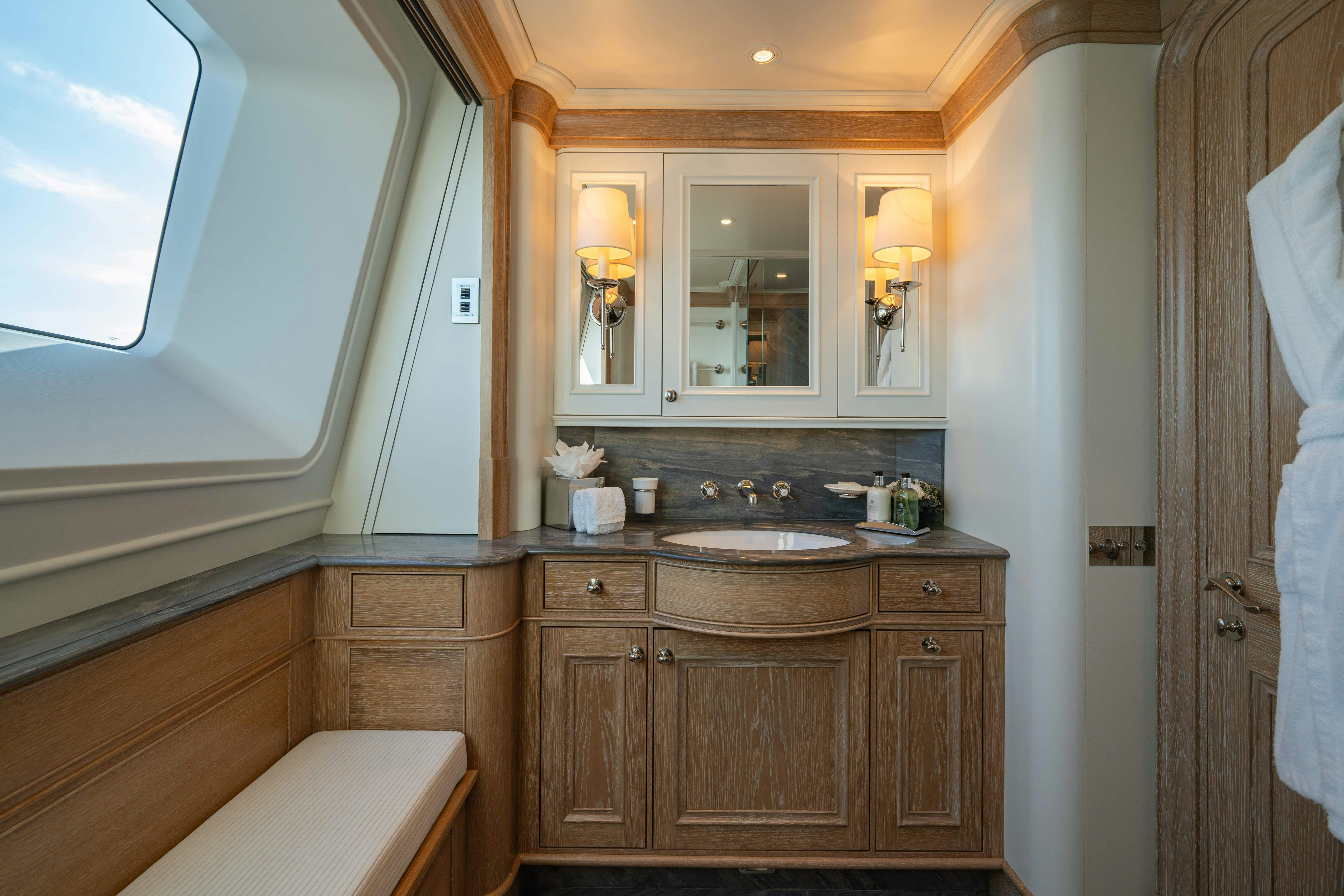 a bathroom with a sink and cabinets aboard FABULOUS CHARACTER Yacht for Charter