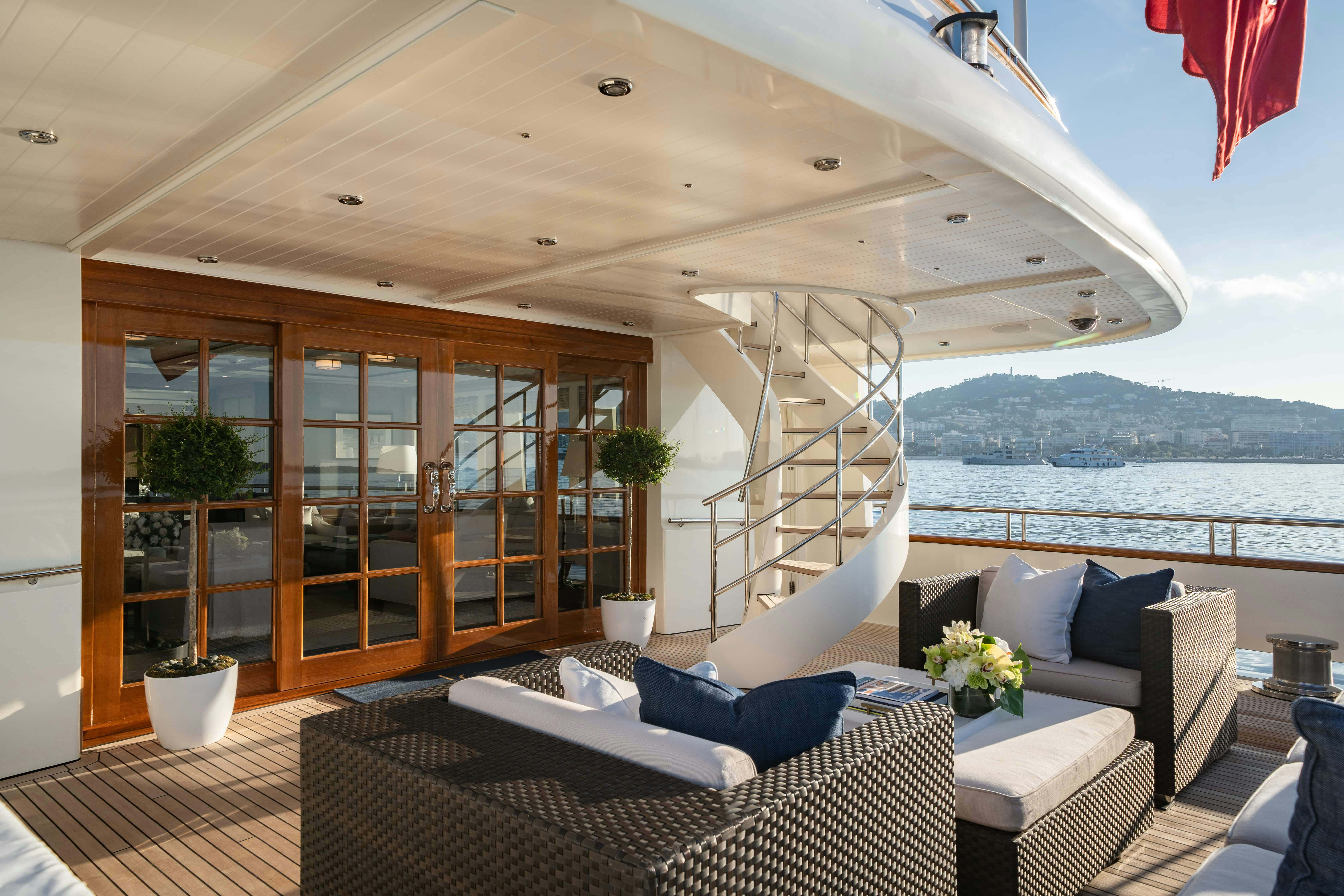 a living room with a large window aboard FABULOUS CHARACTER Yacht for Charter