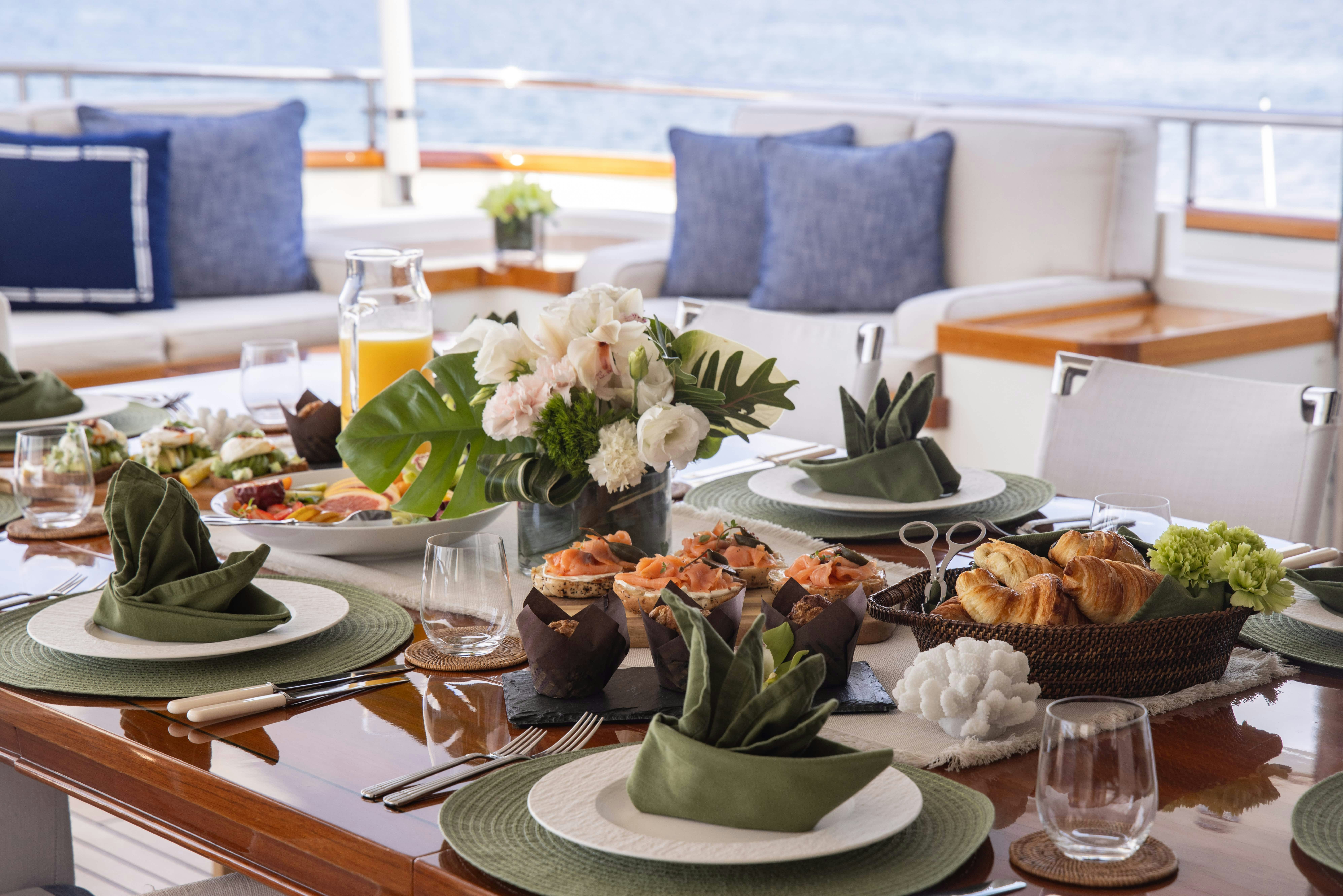 a table with food and drinks aboard FABULOUS CHARACTER Yacht for Charter