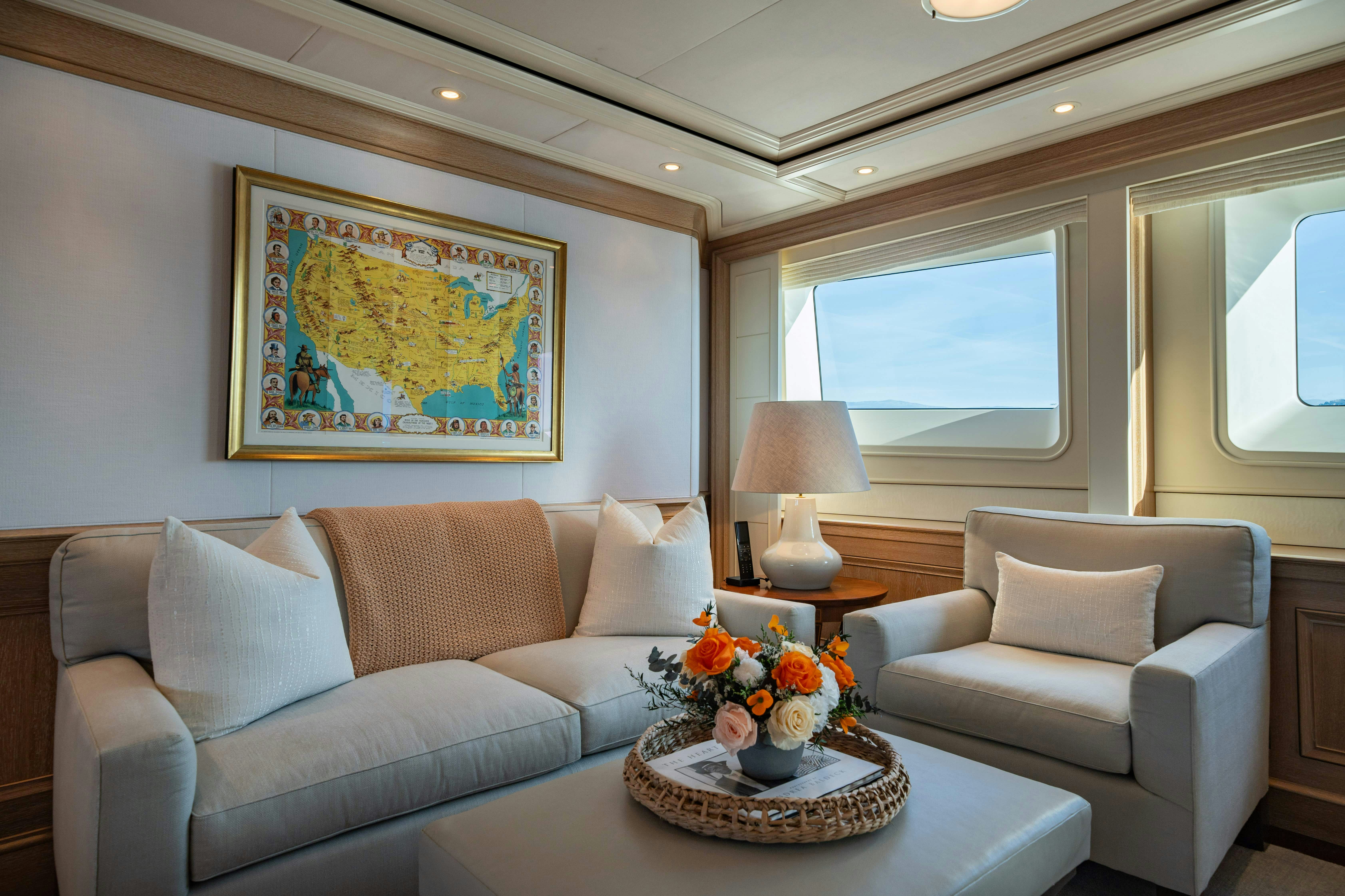 a living room with a couch and a coffee table aboard FABULOUS CHARACTER Yacht for Charter