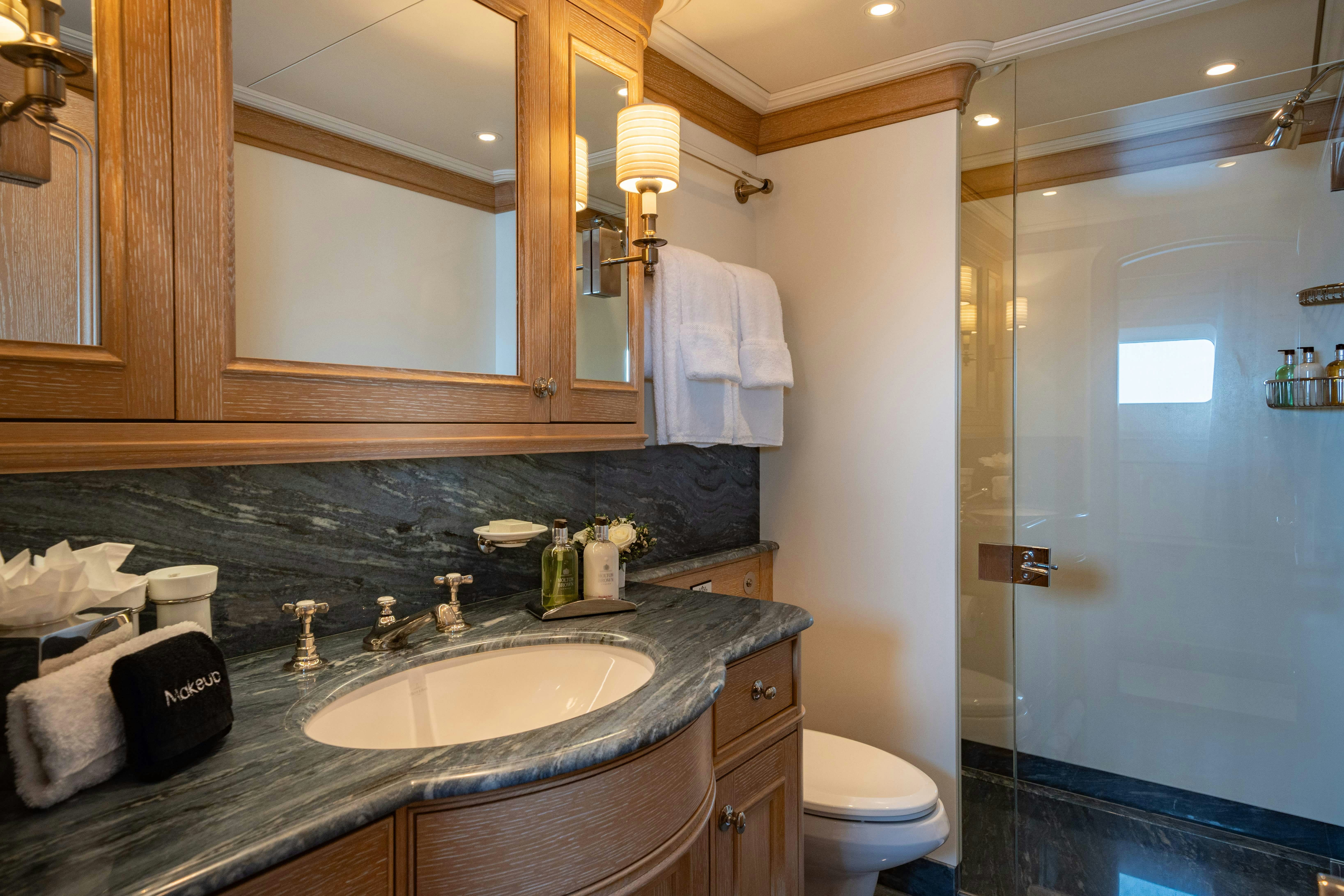 a bathroom with a sink and a shower aboard FABULOUS CHARACTER Yacht for Charter
